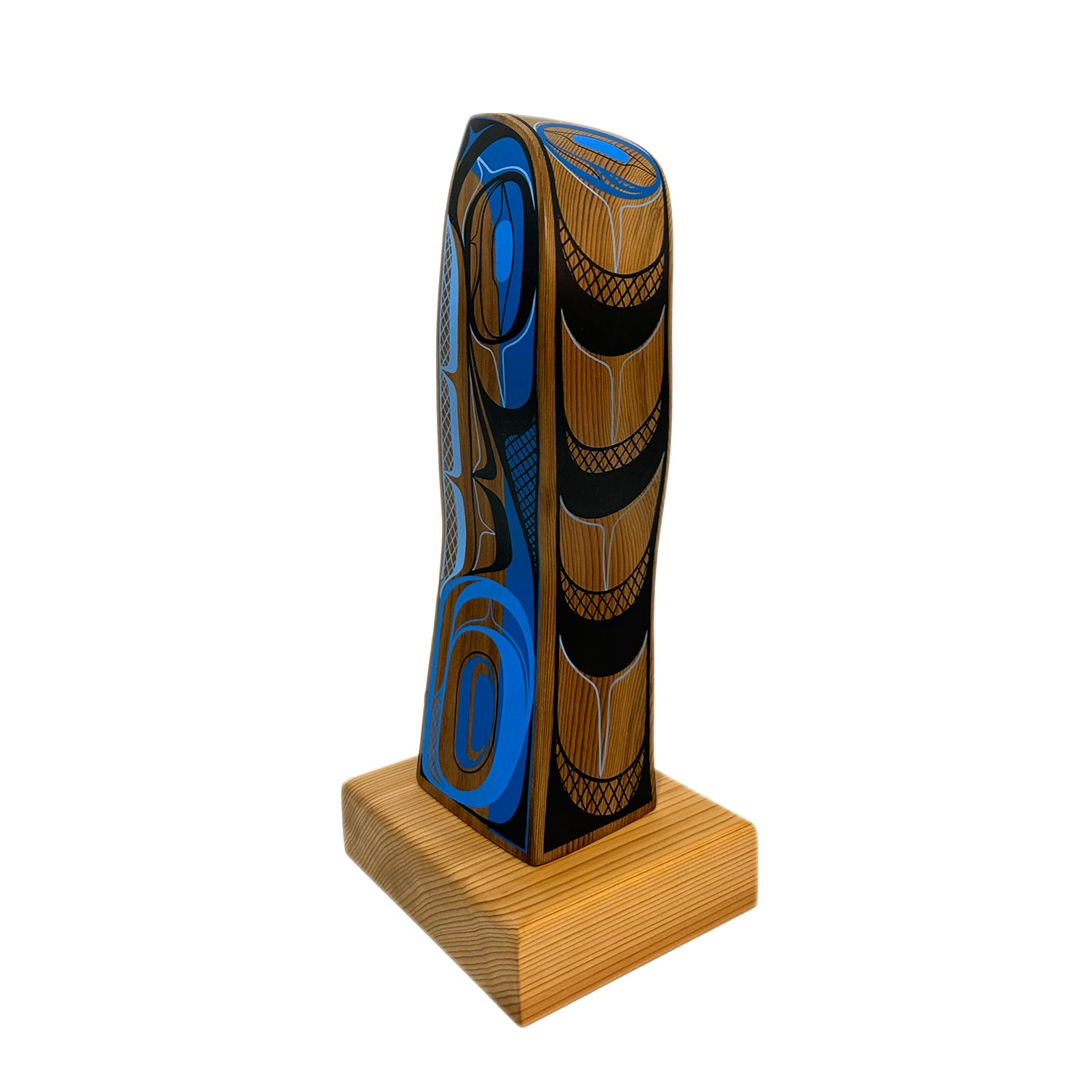 Decorative object with blue and brown patterns on a wooden base against a white background