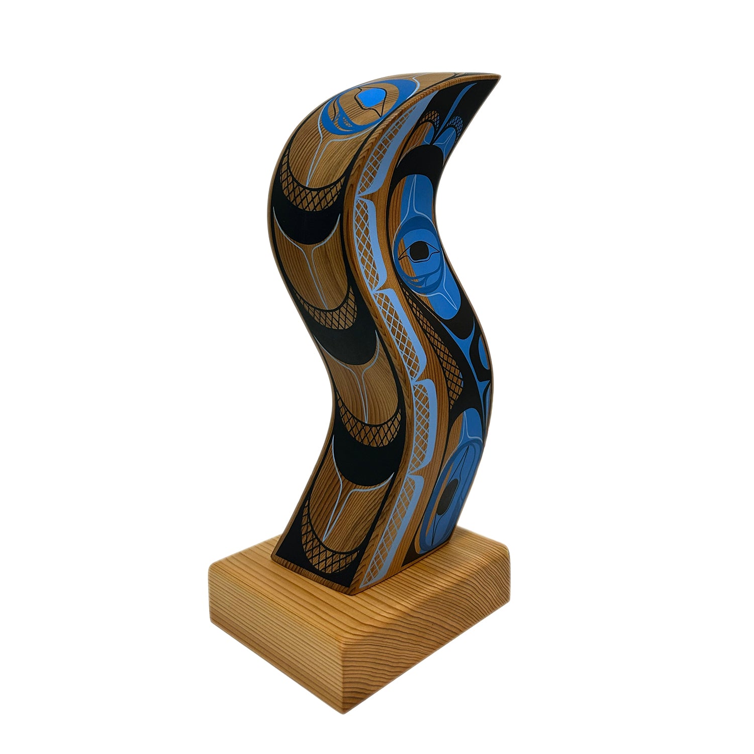 Wooden sculpture with intricate carvings on a white background