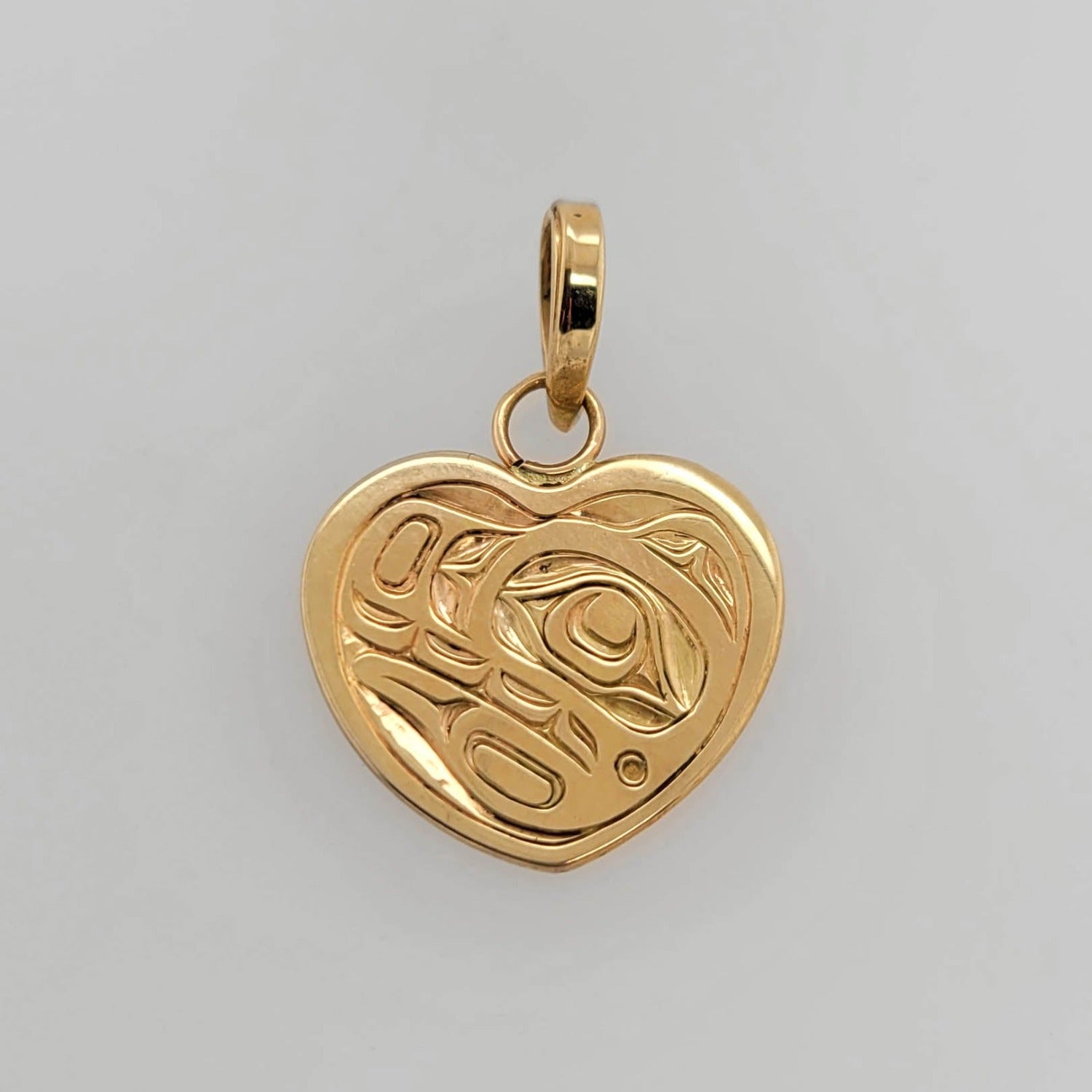 Gold Bear Heard Pendant by Kwakwaka'wakw artist Joe Wilson