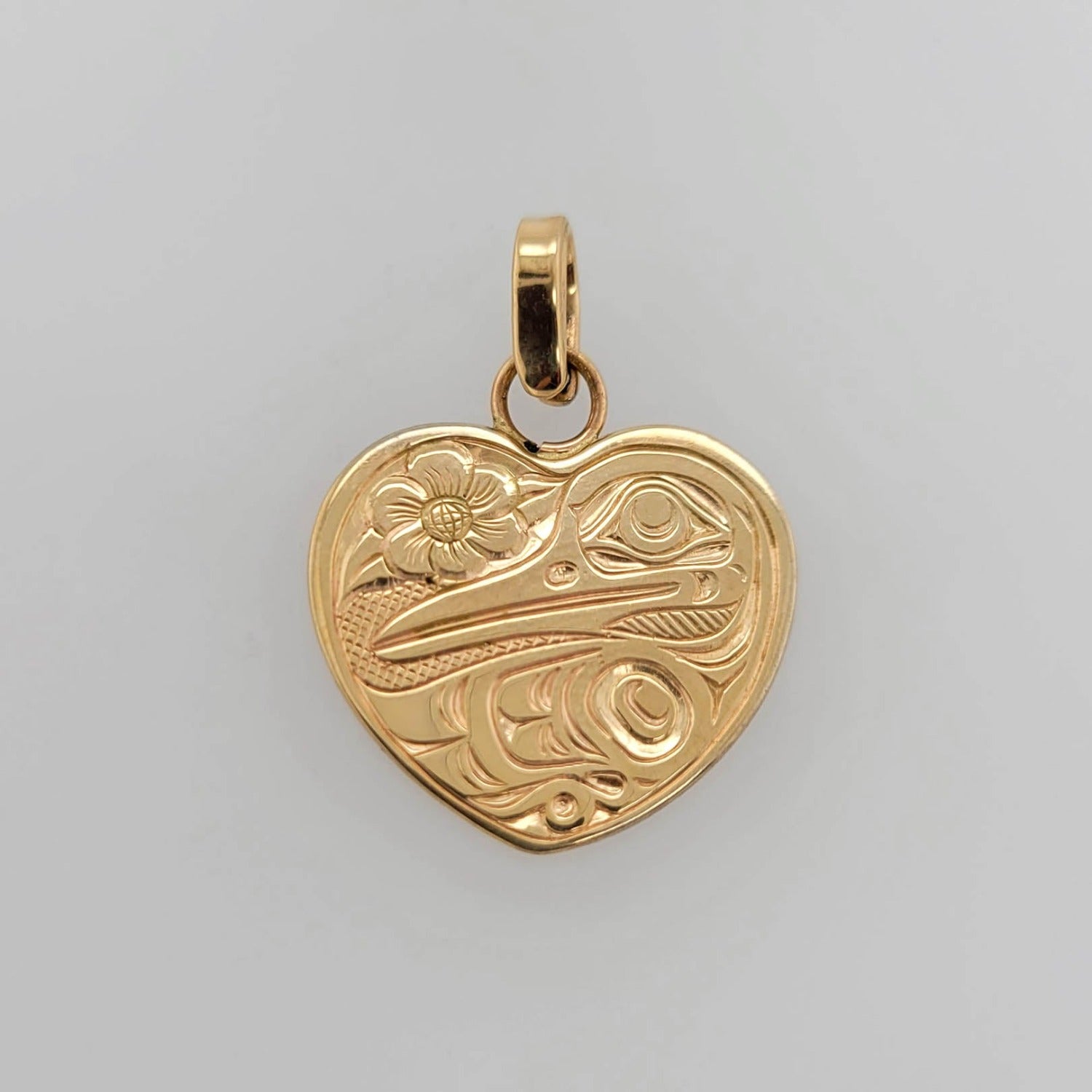 Gold Hummingbird Heard Pendant by Kwakwaka'wakw artist Joe Wilson