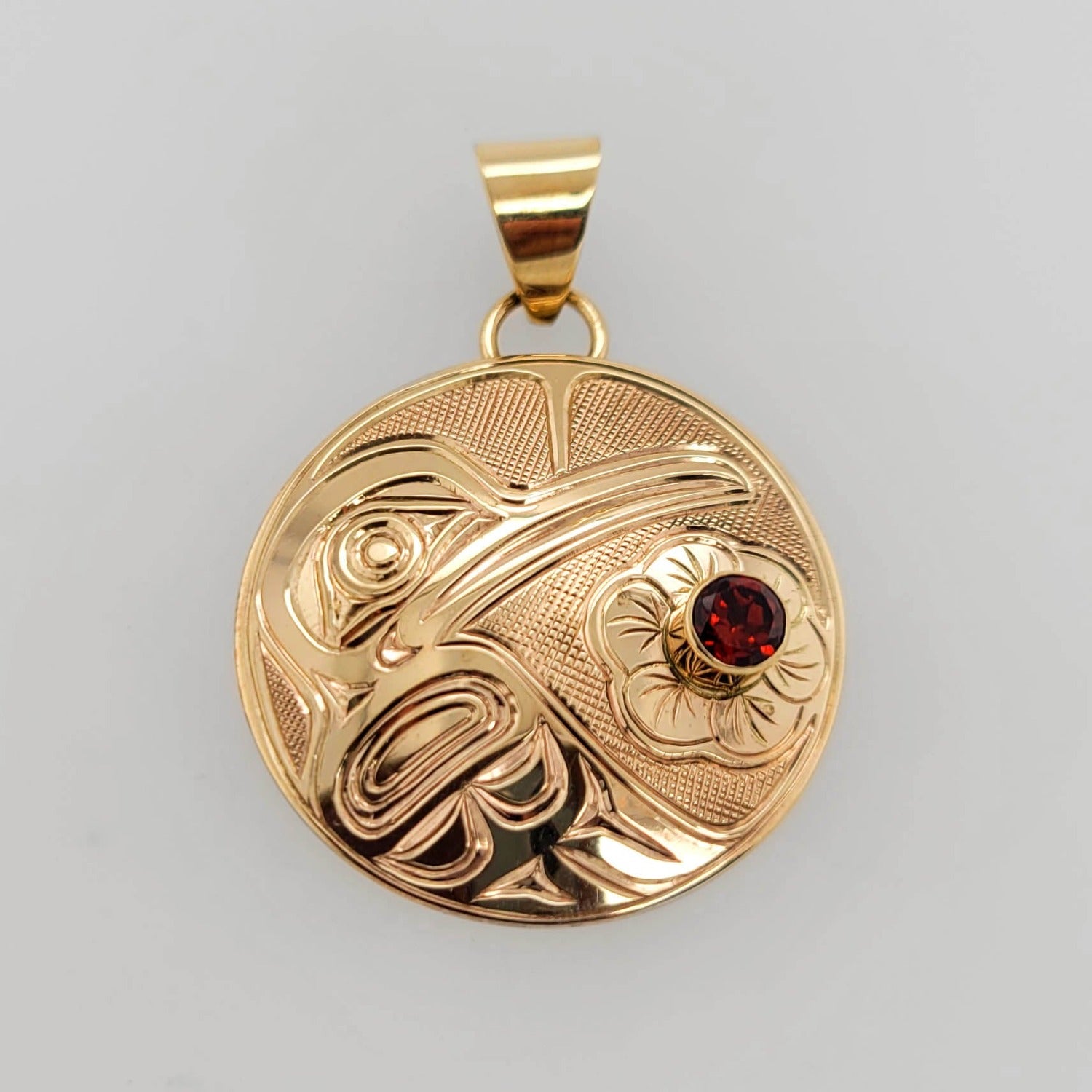Gold Hummingbird Pendant by Kwakwaka'wakw artist Chris Cook