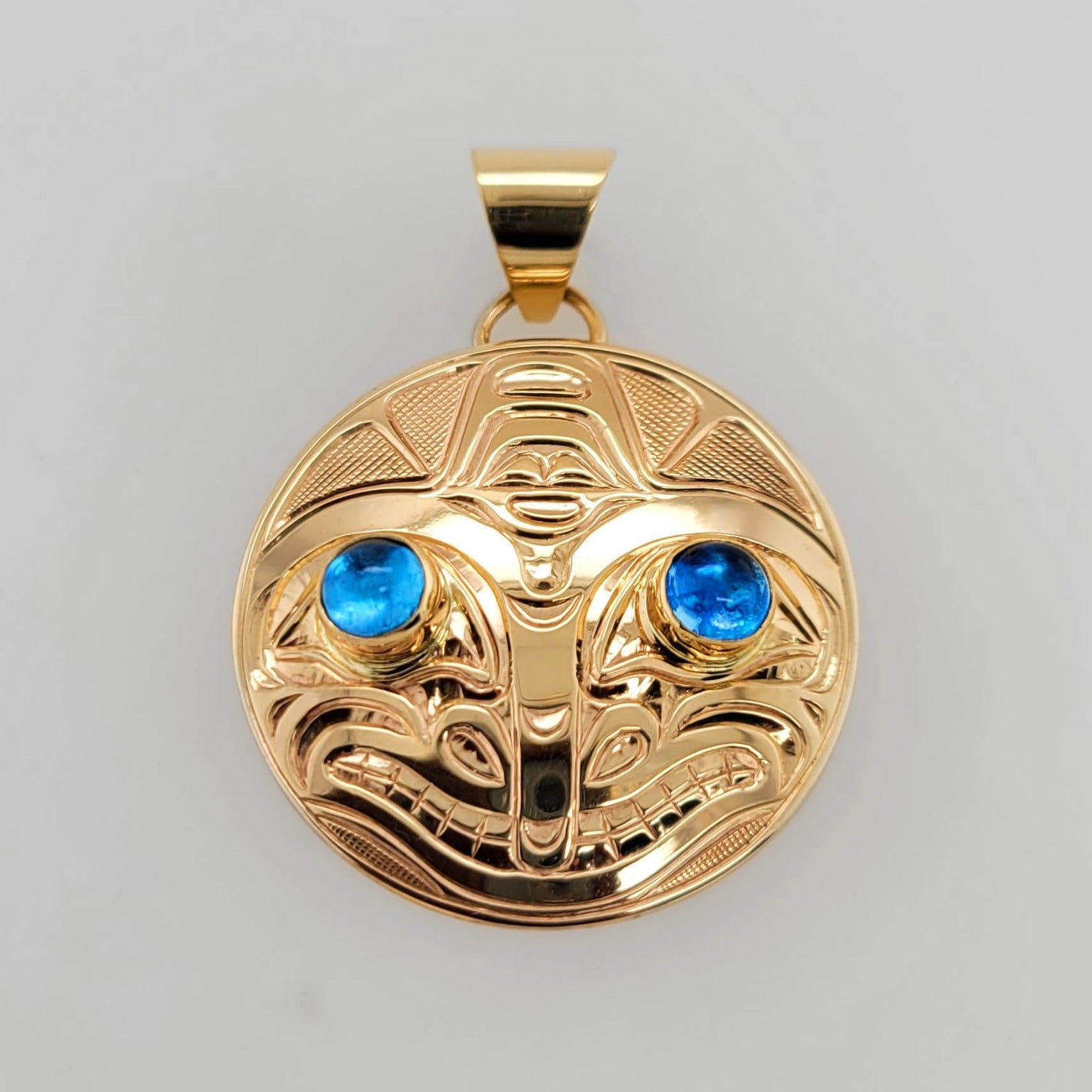 Gold Orca Pendant by Kwakwaka'wakw artist Chris Cook