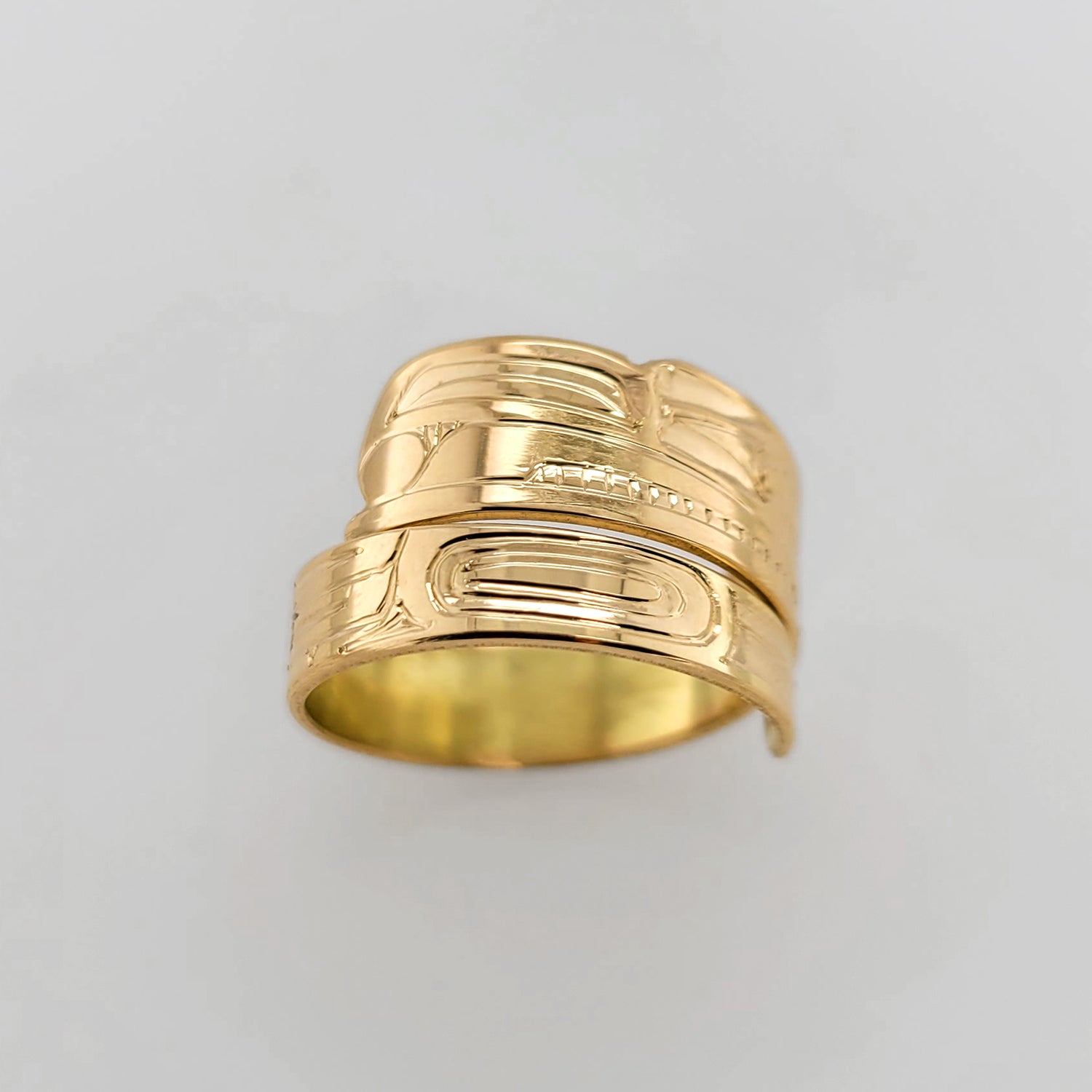 Gold Raven Steals the Light Wrap Ring by Haida artist Garner Moody
