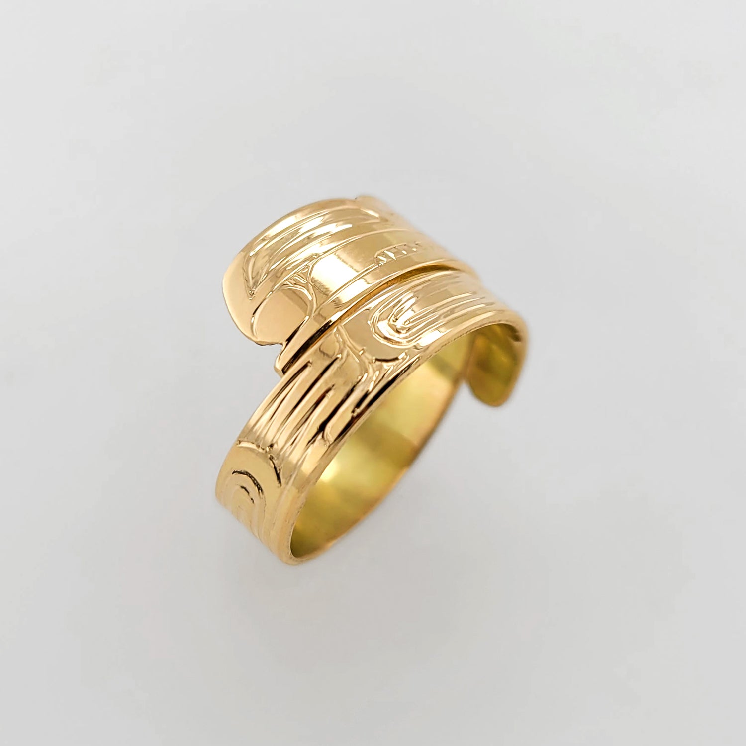 Gold Raven Steals the Light Wrap Ring by Haida artist Garner Moody