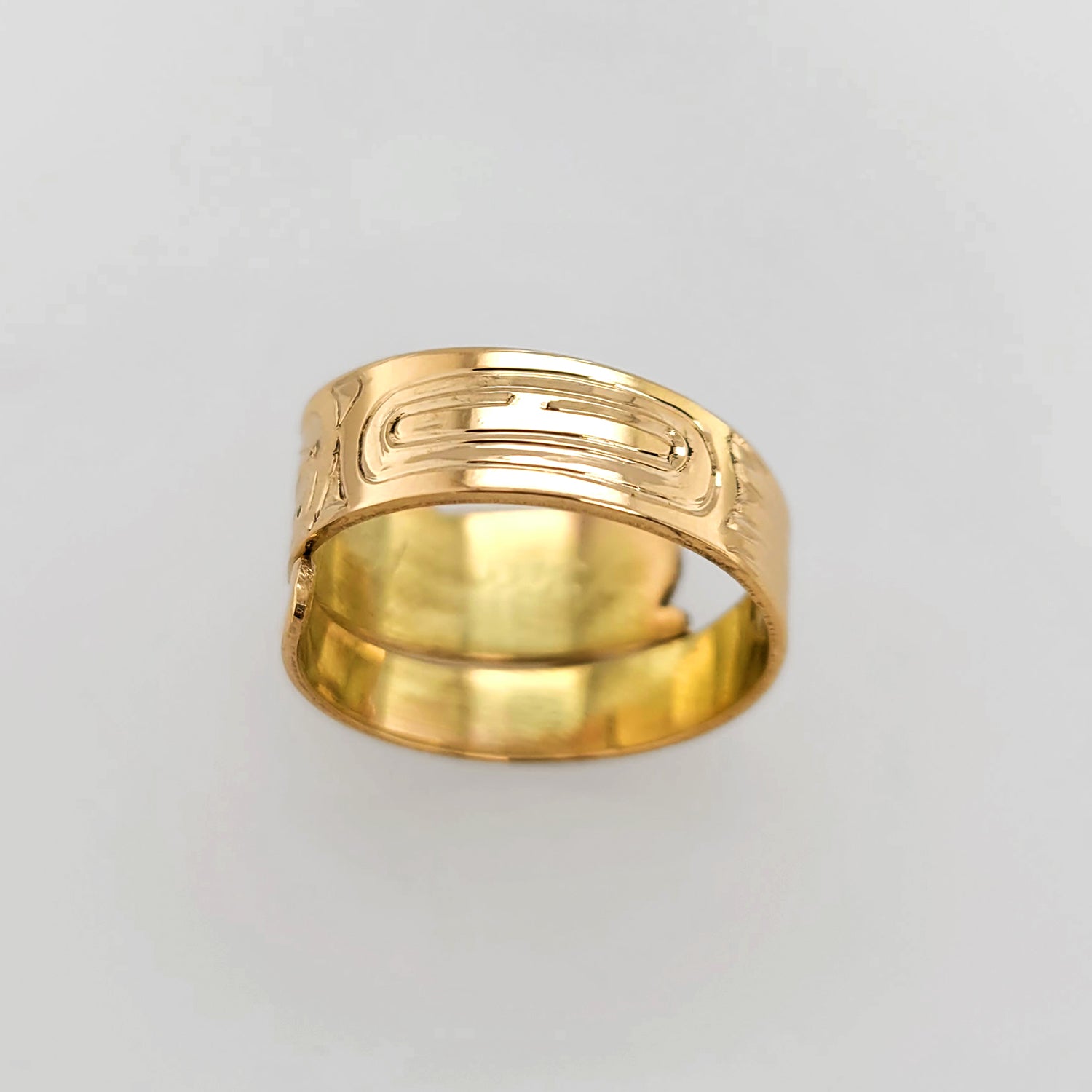 Gold Raven Steals the Light Wrap Ring by Haida artist Garner Moody