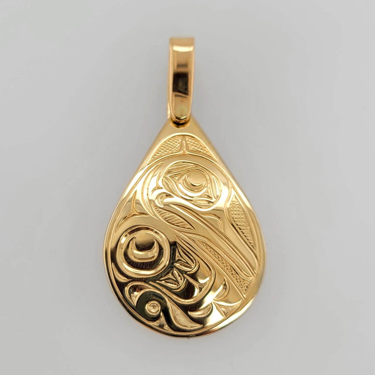 Gold Hummingbird Pendant by Kwakwaka'wakw artist Joe Wilson