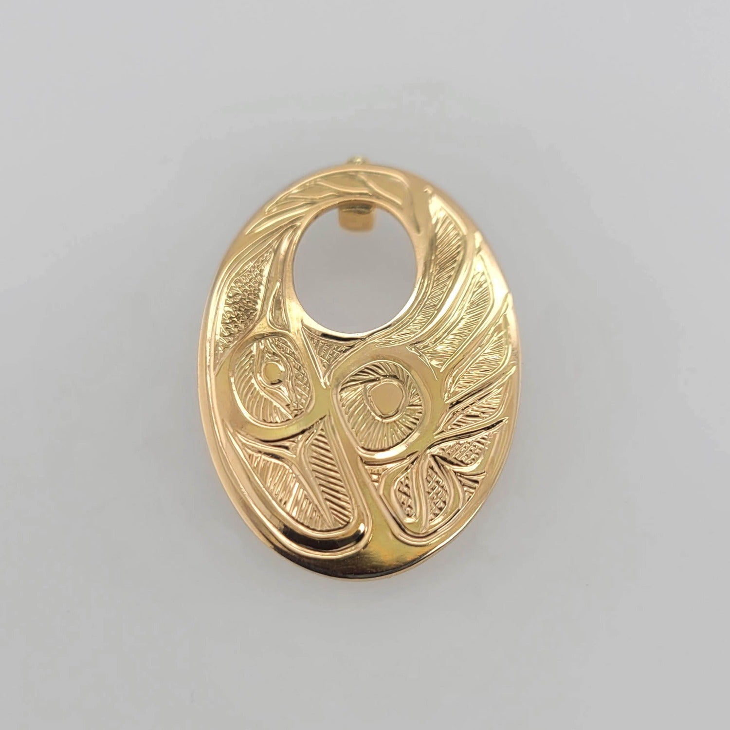 Gold Hummingbird Pendant by Tsimshian artist Bill Helin
