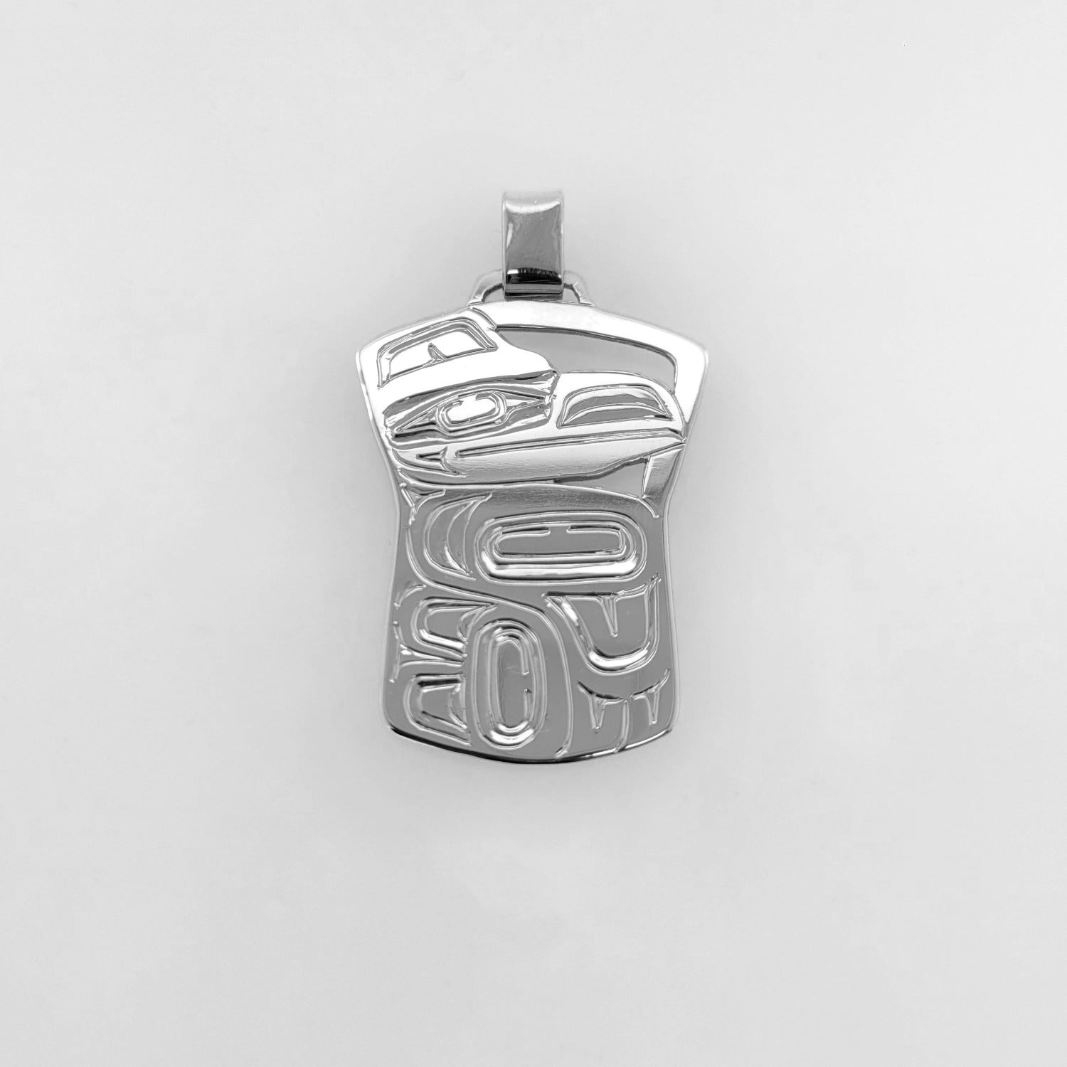 this is a Silver Haida Copper-shaped Raven Pendant