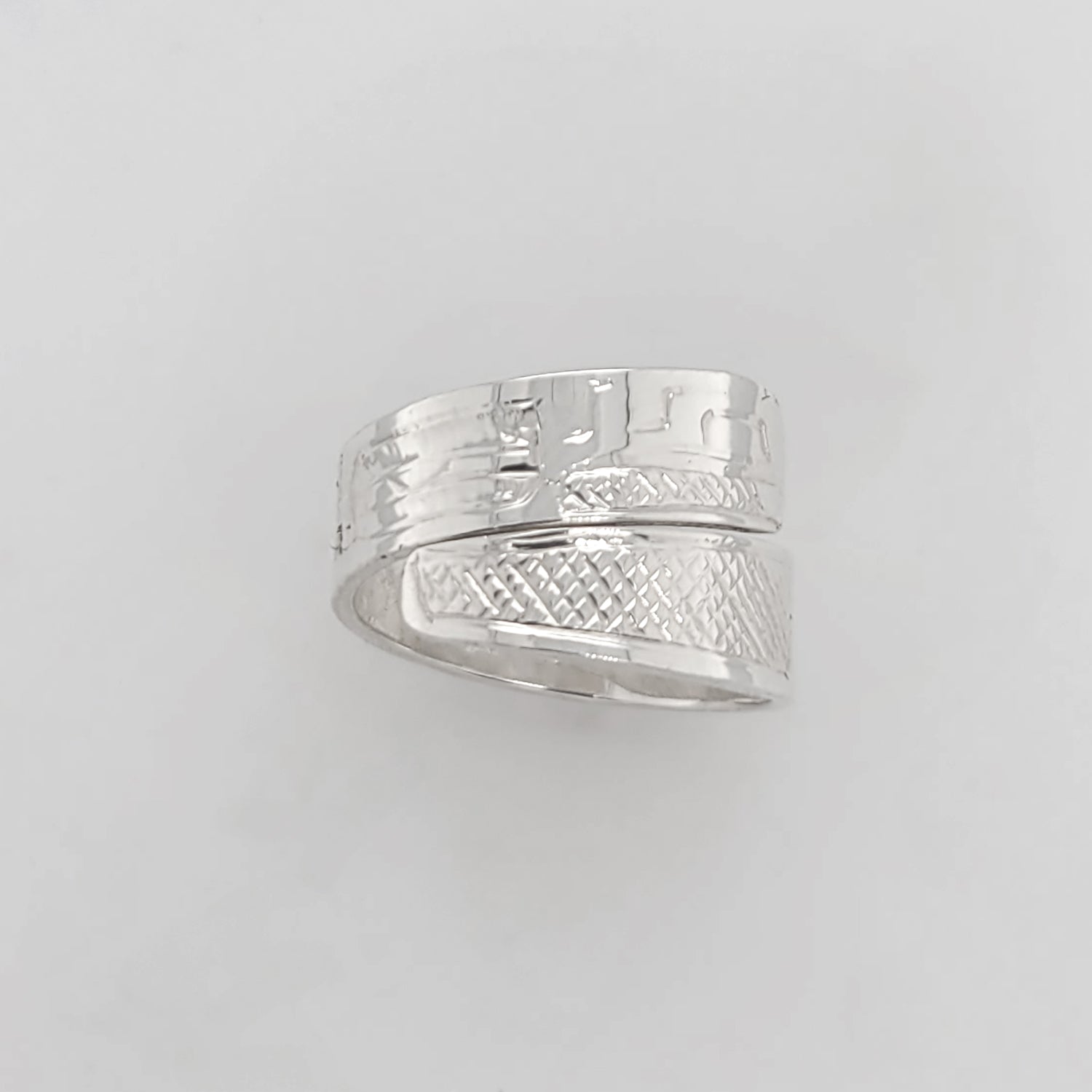 Silver Raven Steals the Light Wrap Ring by Tahltan artist Terrence Campbell