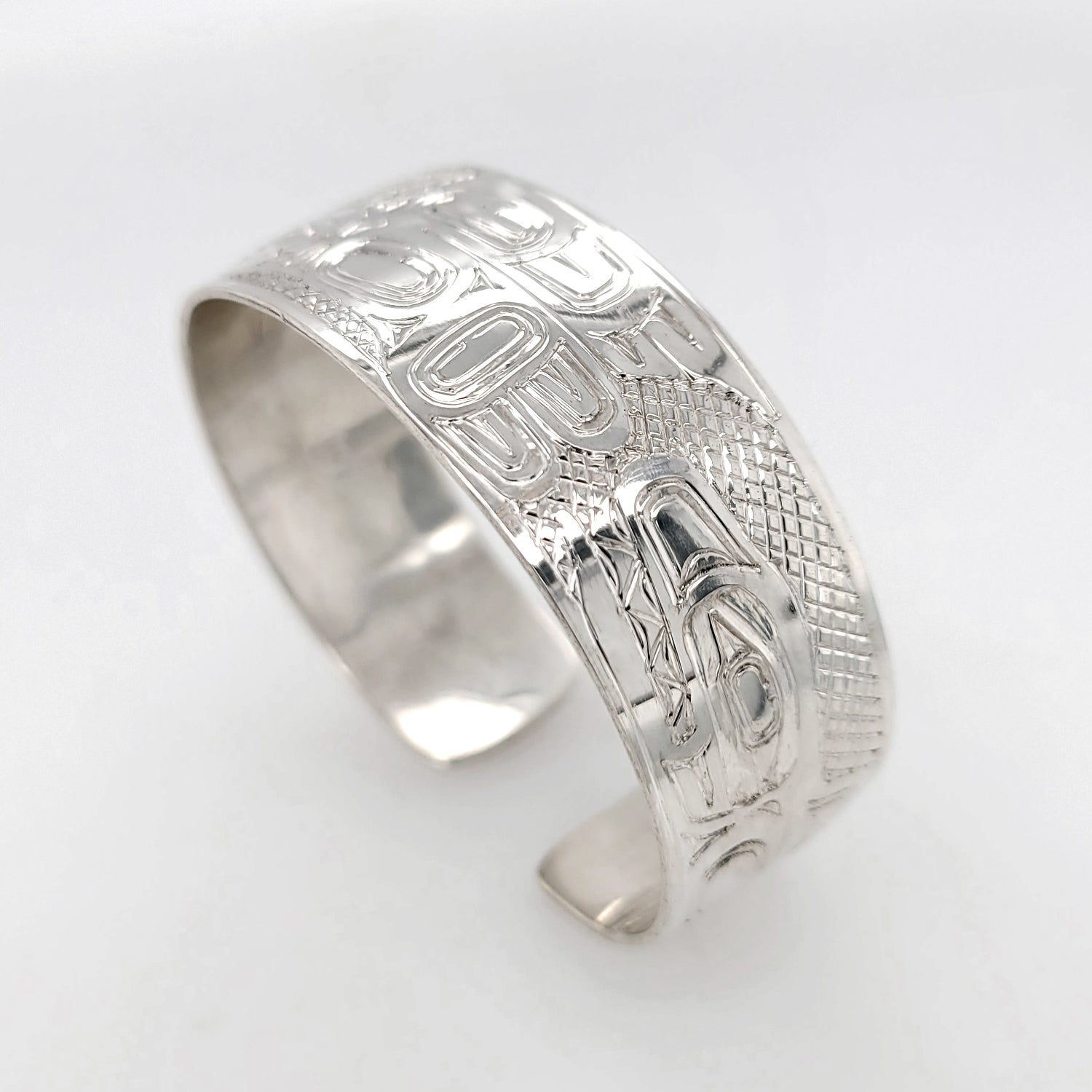 Silver Eagle, Raven, and Orca Bracelet by Haida artist Garner Moody