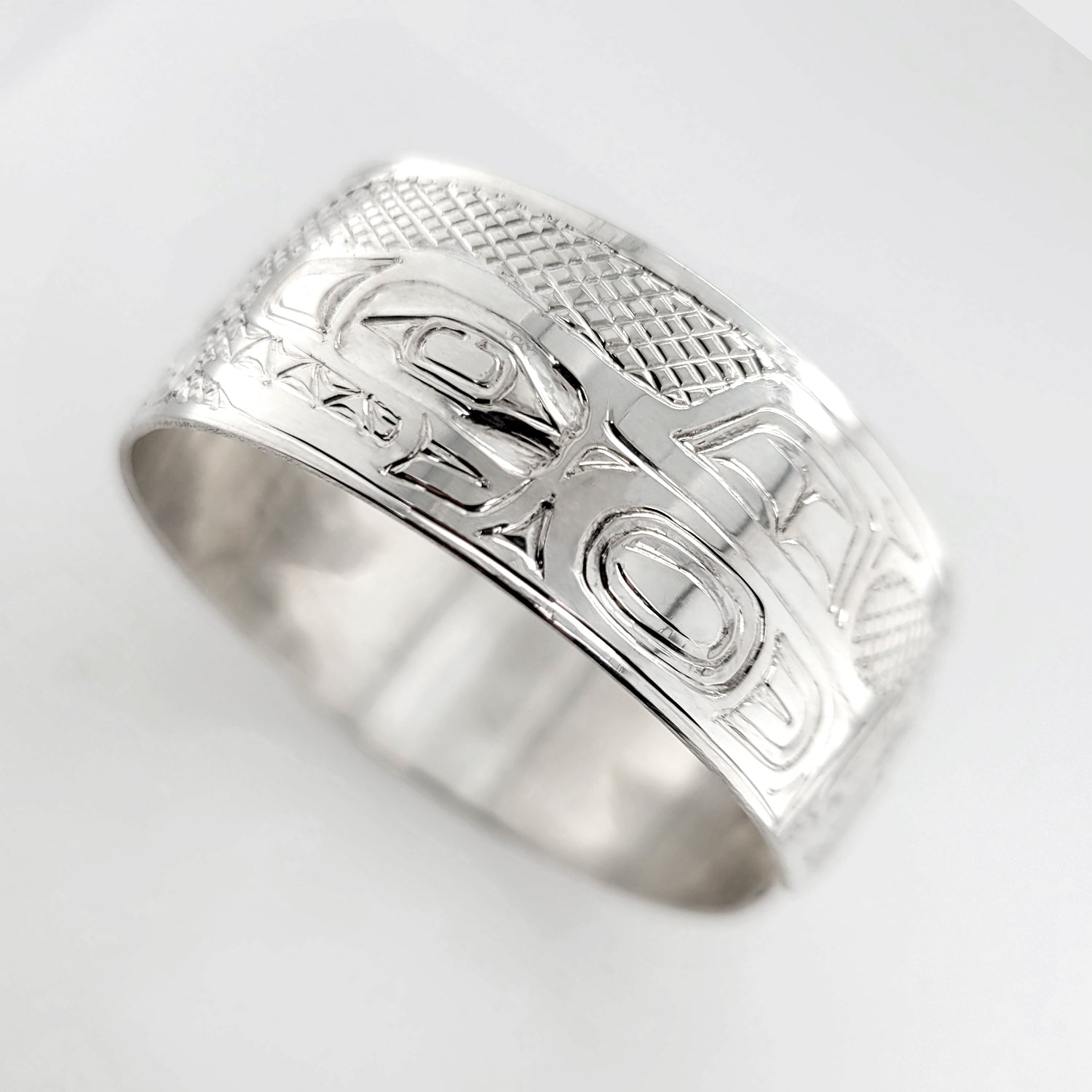 Silver Eagle, Raven, and Orca Bracelet by Haida artist Garner Moody