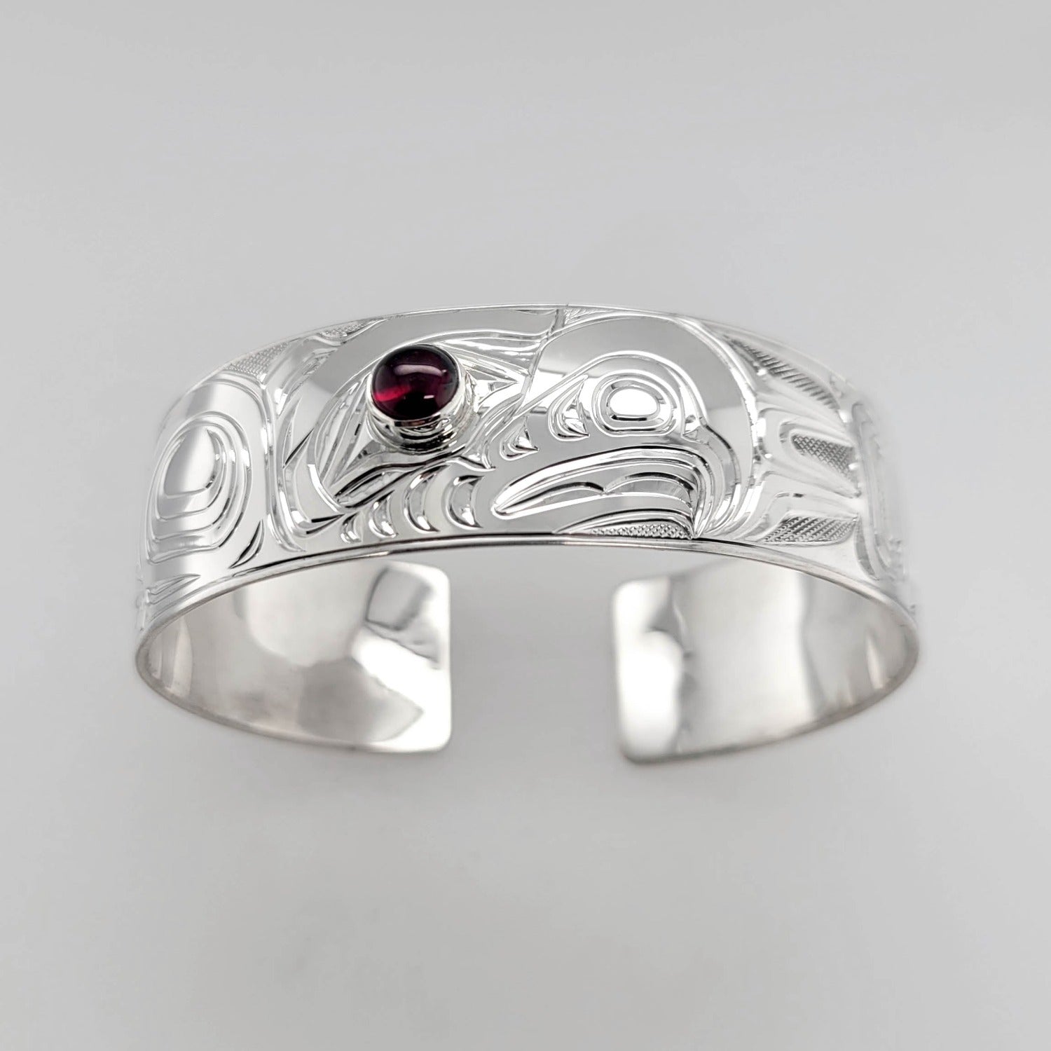 Silver and Garnet Eagle Bracelet by Kwakwaka'wakw artist Chris Cook