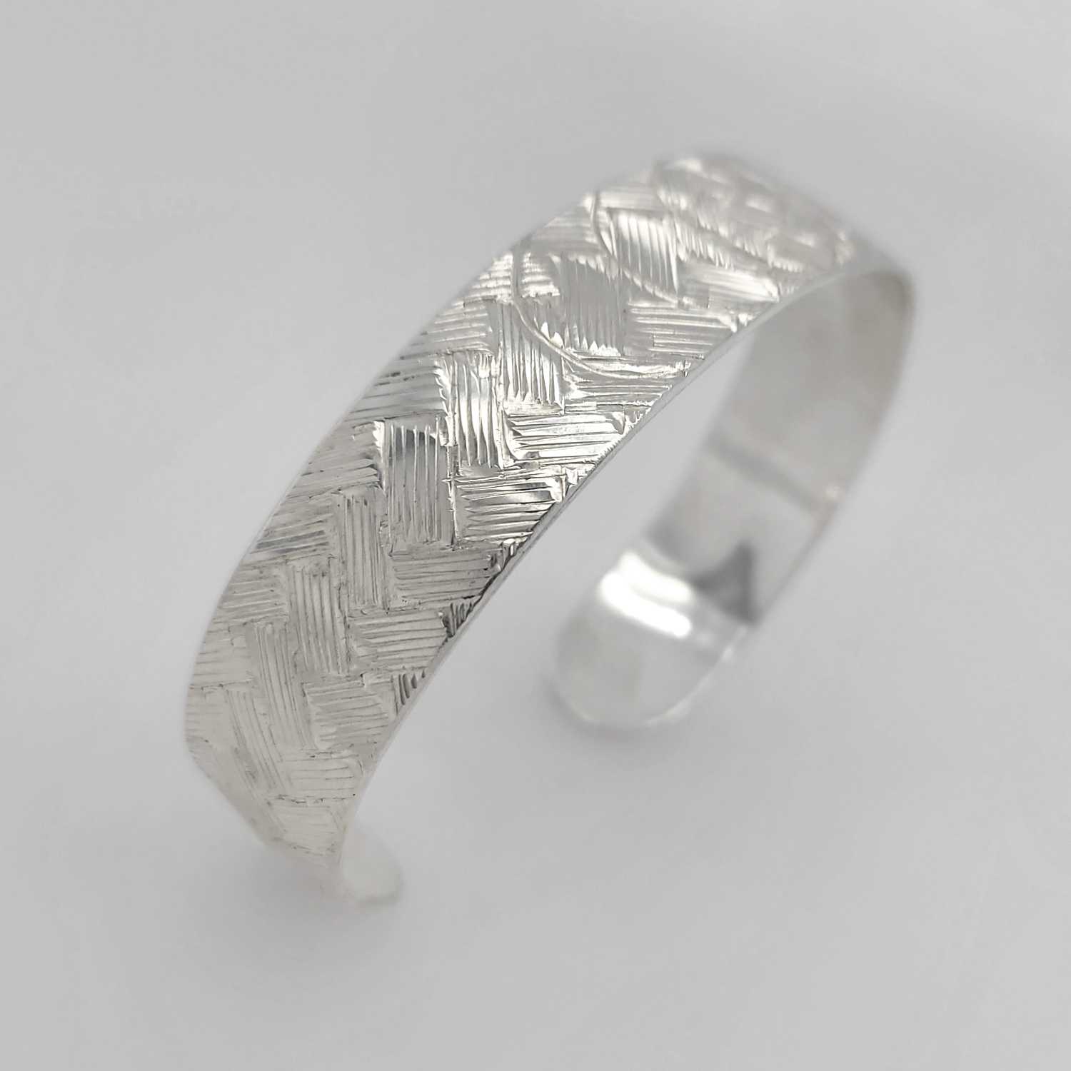 Silver Solar Eclipse Bracelet by Coast Salish artist Jody Sparrow