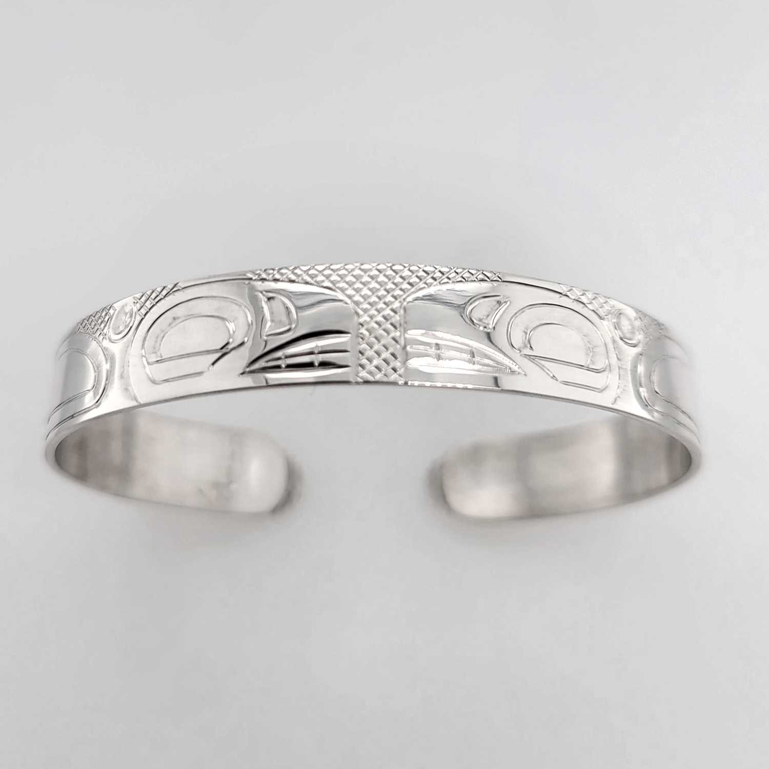 Silver Orca Bracelet hand-carved by Cree artist Justin Rivard