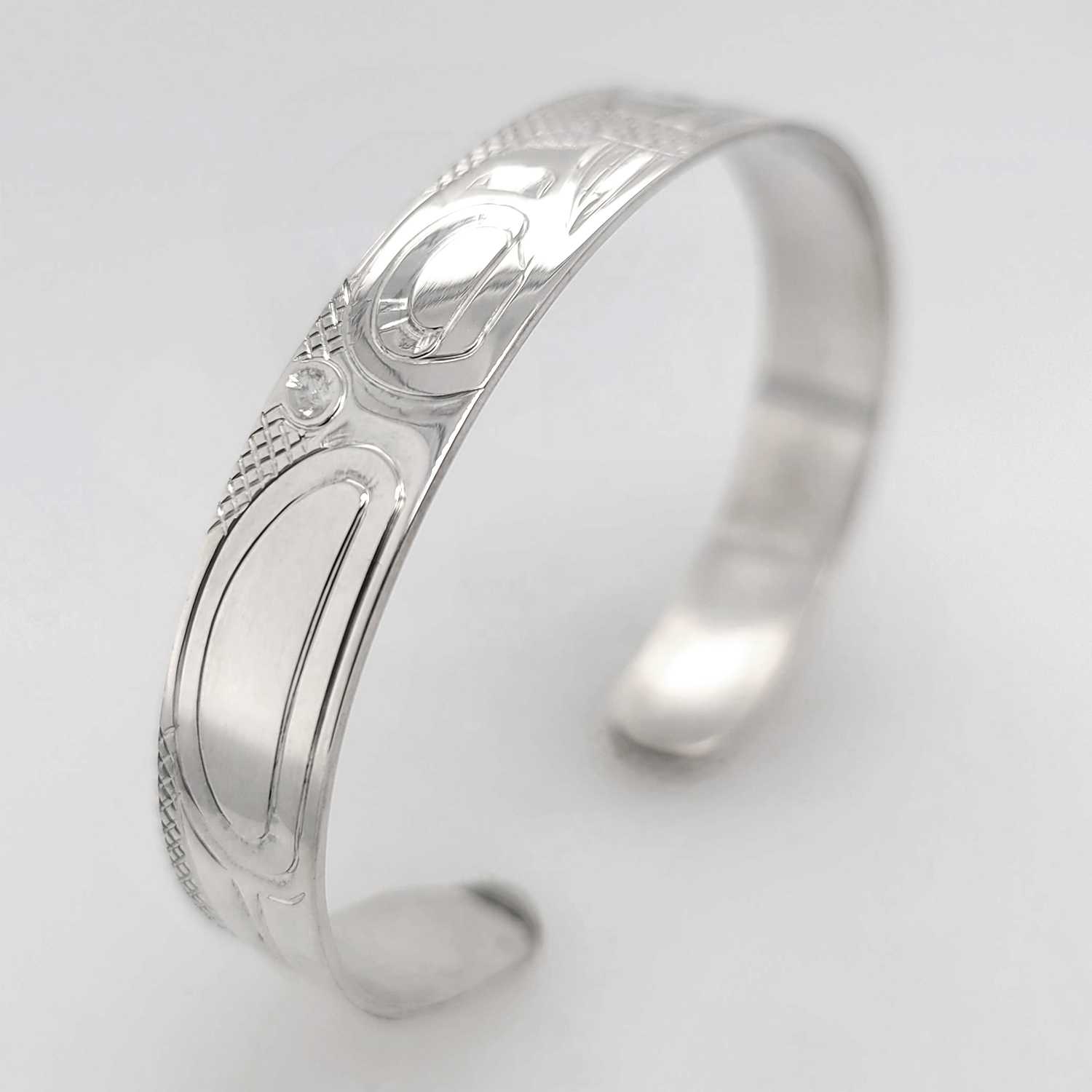 Silver Orca Bracelet hand-carved by Cree artist Justin Rivard