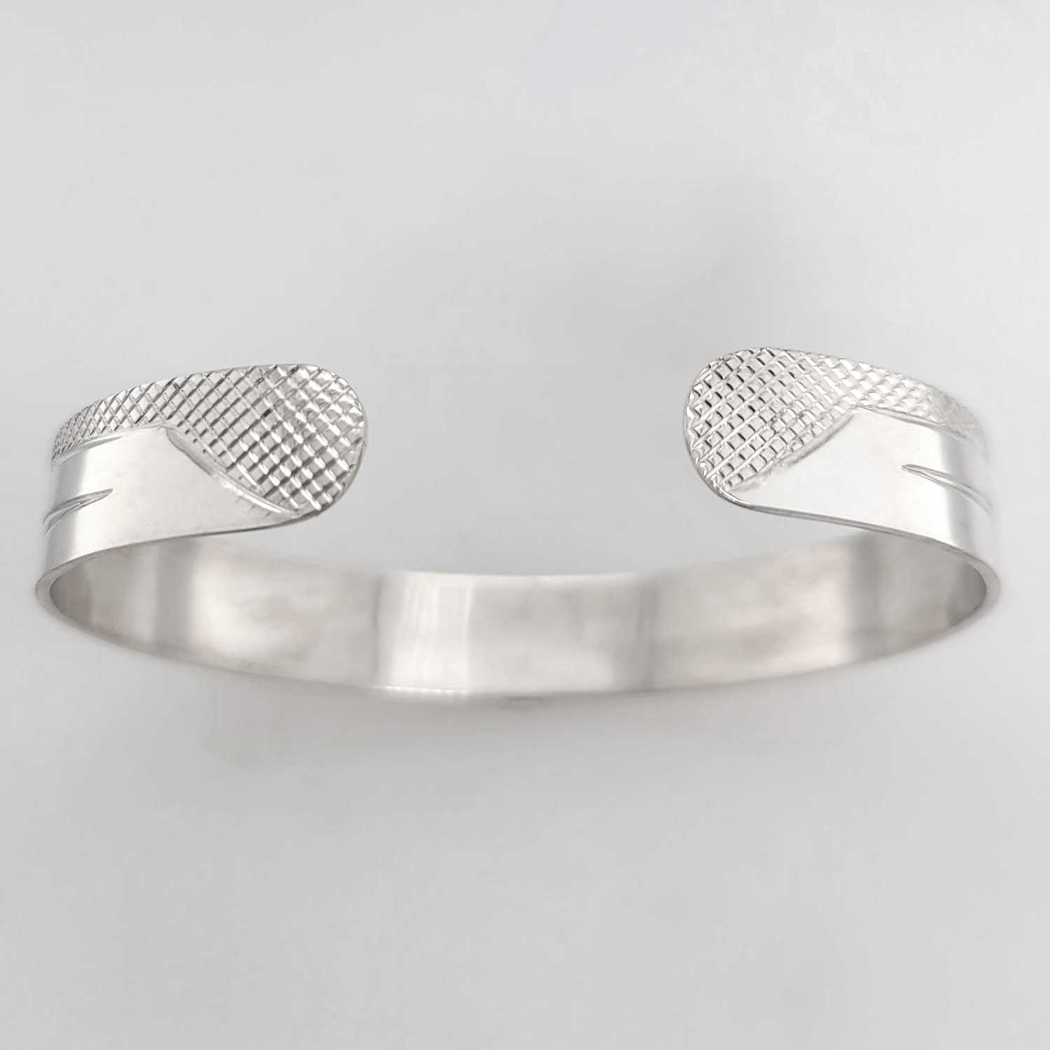 Silver Orca Bracelet hand-carved by Cree artist Justin Rivard