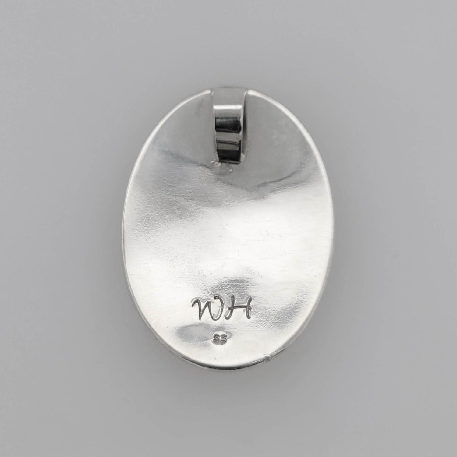 Silver Oval Raven Pendant by Tsimshian artist Bill Helin