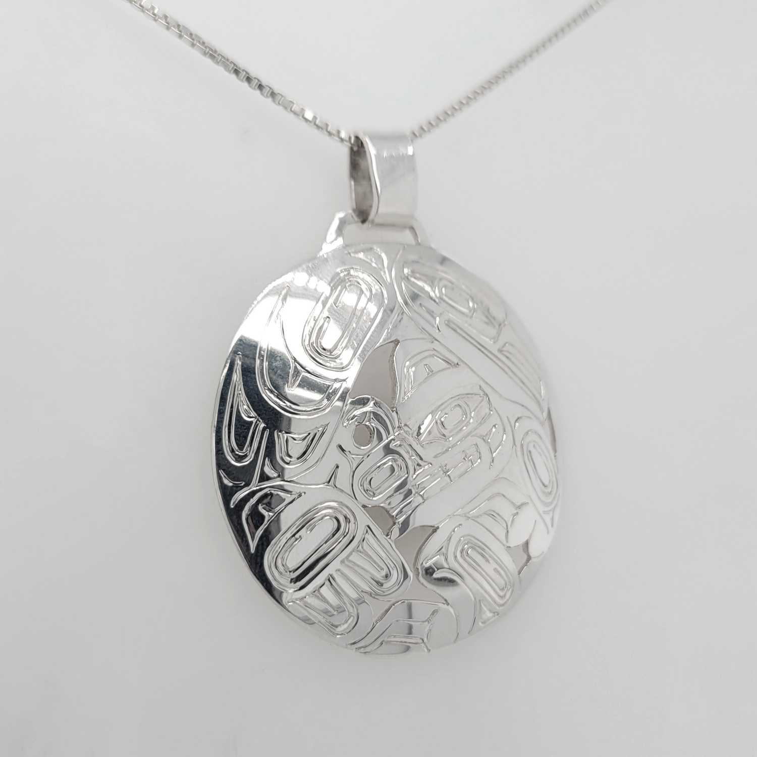Silver Raven and Bear Pendant by Haida artist Garner Moody