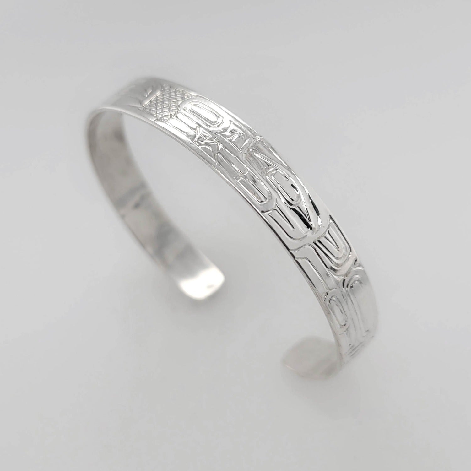 Silver Raven and Wolf Bracelet by Haida artist Garner Moody