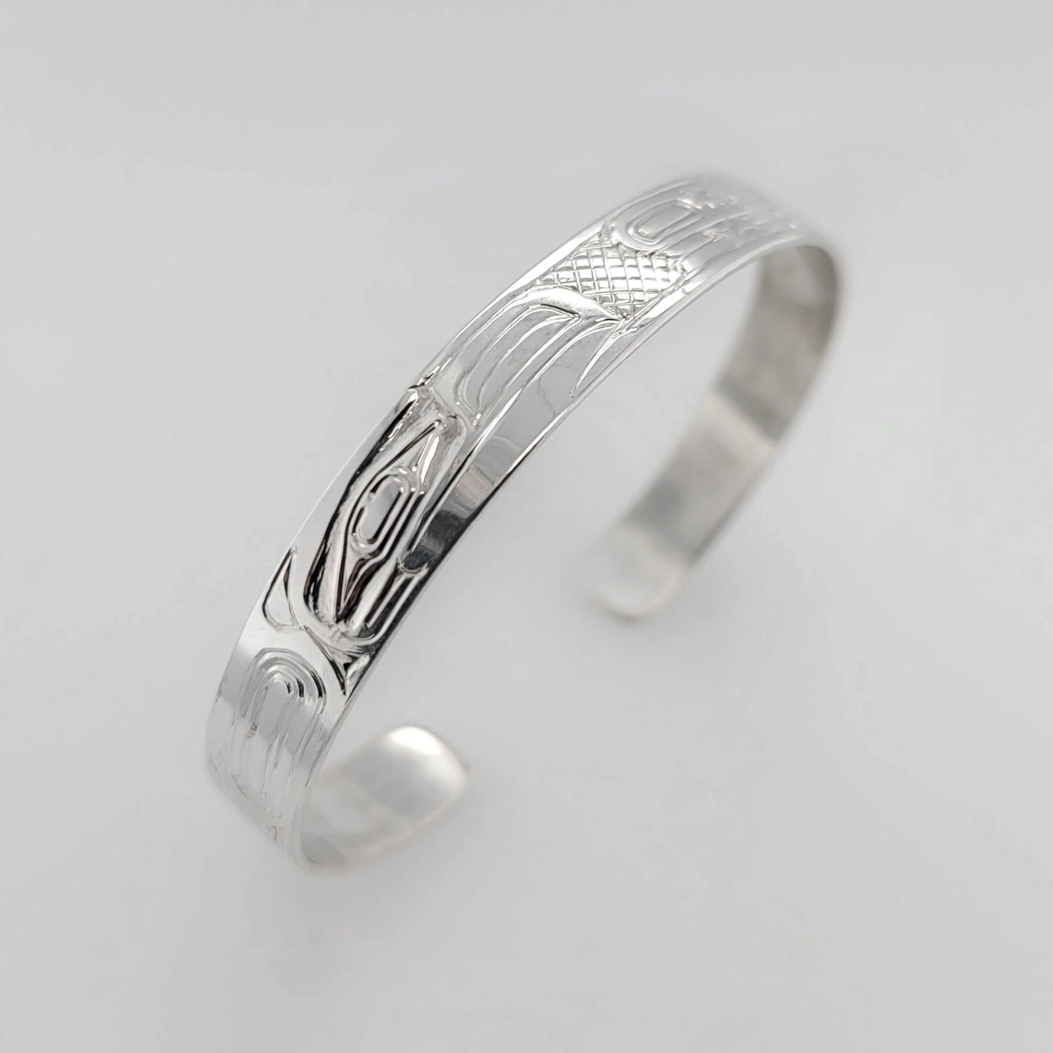 Silver Raven and Wolf Bracelet by Haida artist Garner Moody