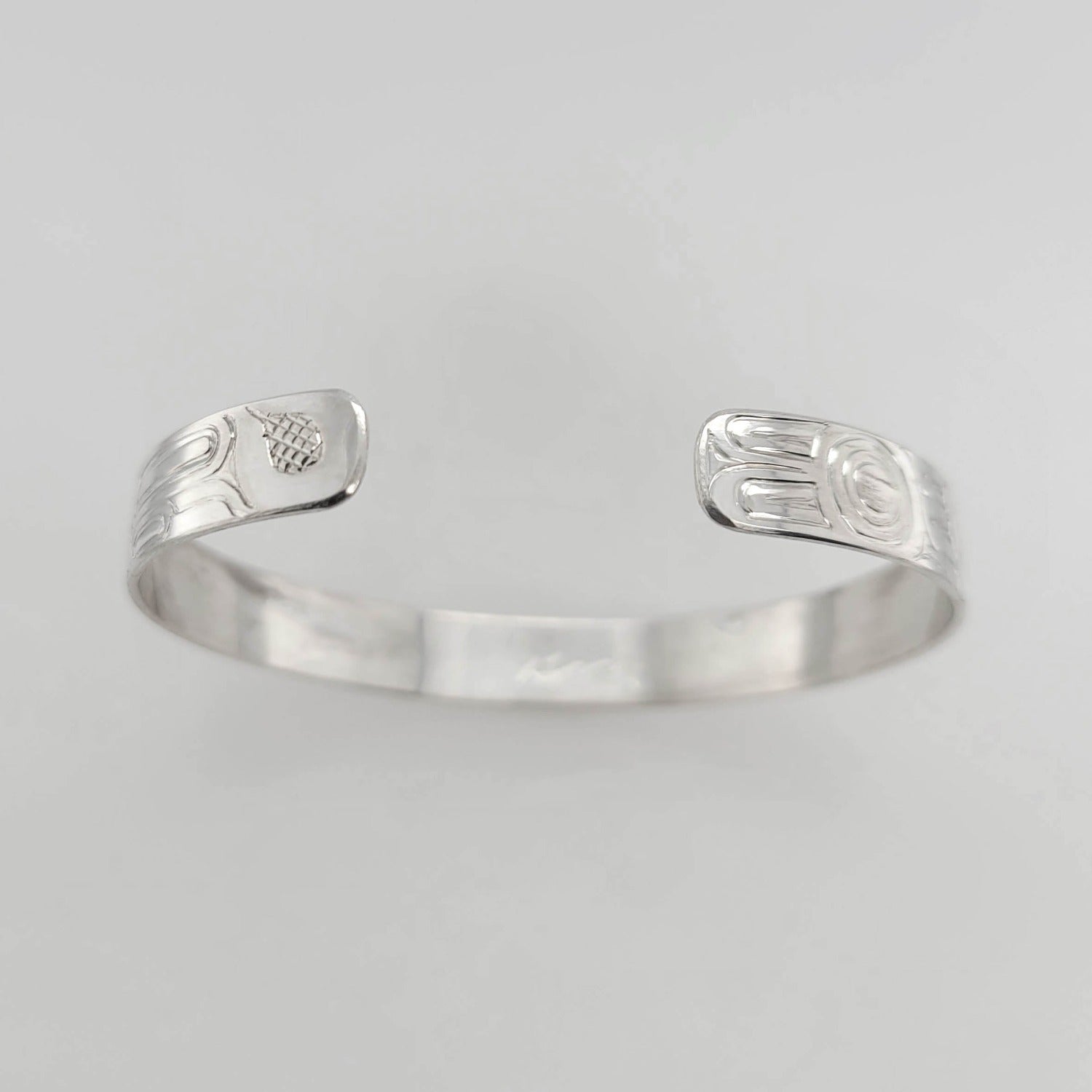 Silver Raven and Wolf Bracelet by Haida artist Garner Moody