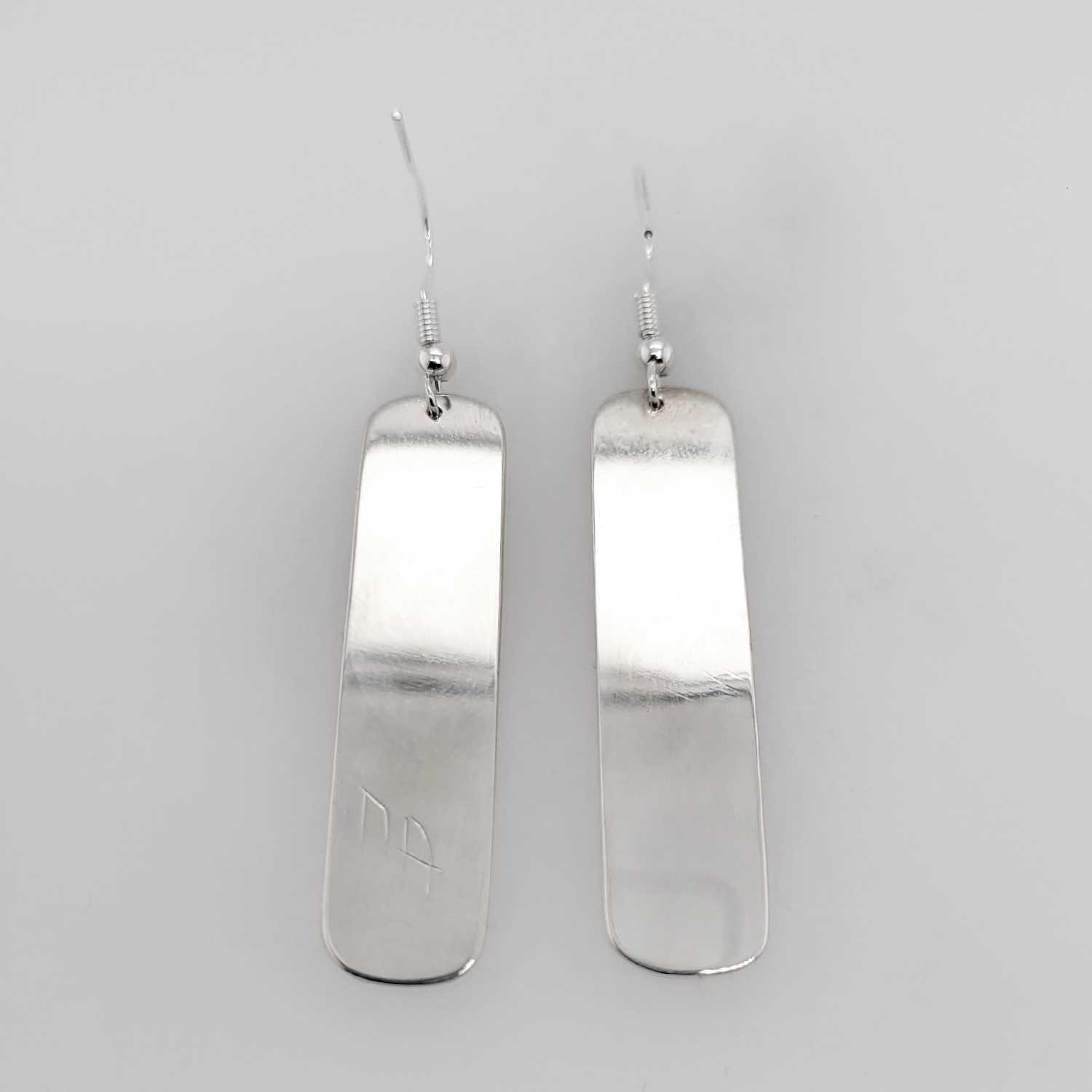 Silver Wolf Earrings by Haida artist Alvin Adkins