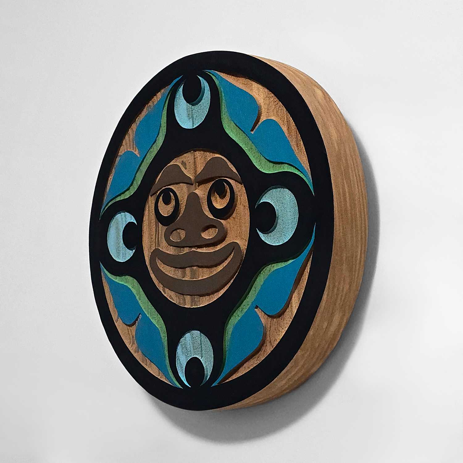 small sandblasted moon panel by Kwakwaka'wakw artist Trevor Hunt
