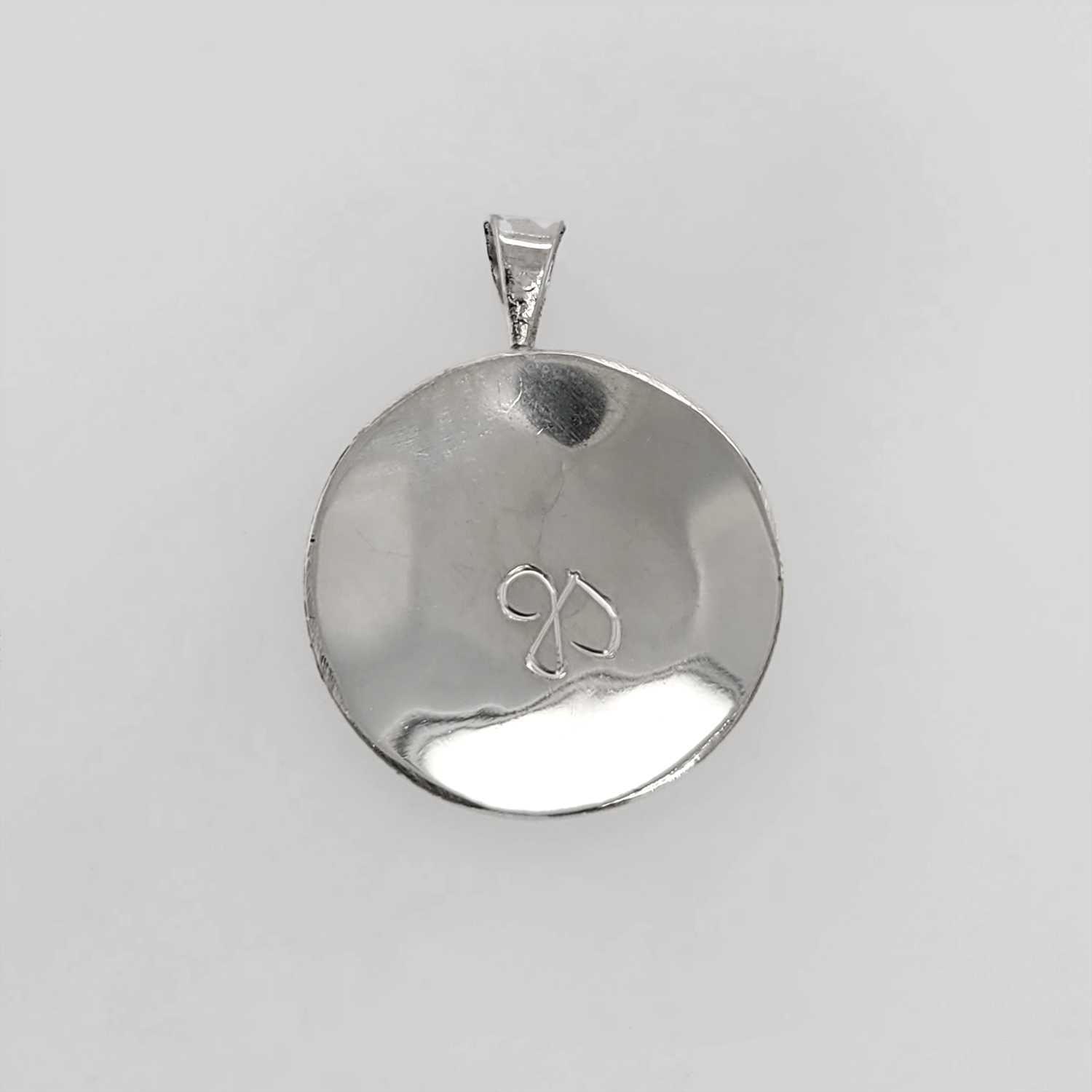 Silver Wolf Pendant by Coast Salish Artist Jody Sparrow