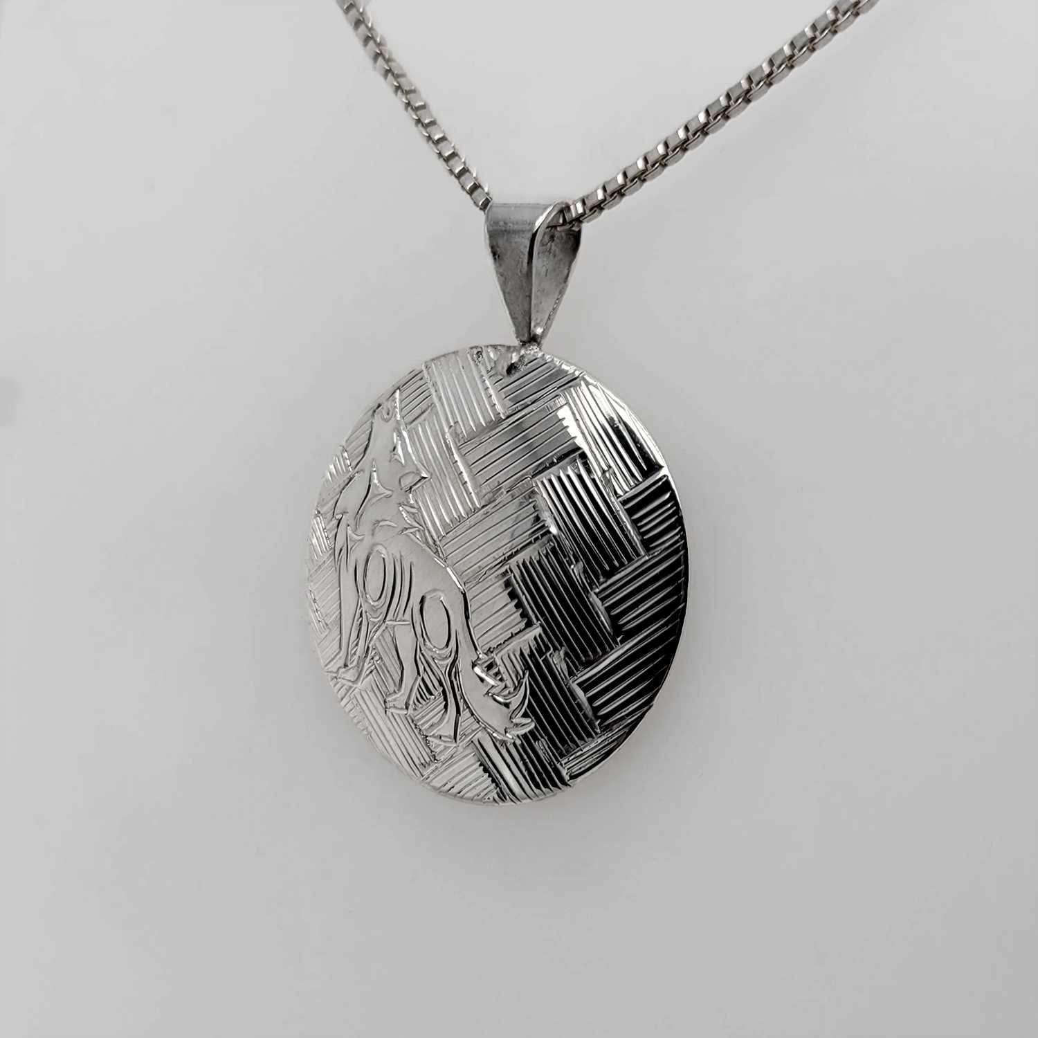 Silver Wolf Pendant by Coast Salish Artist Jody Sparrow