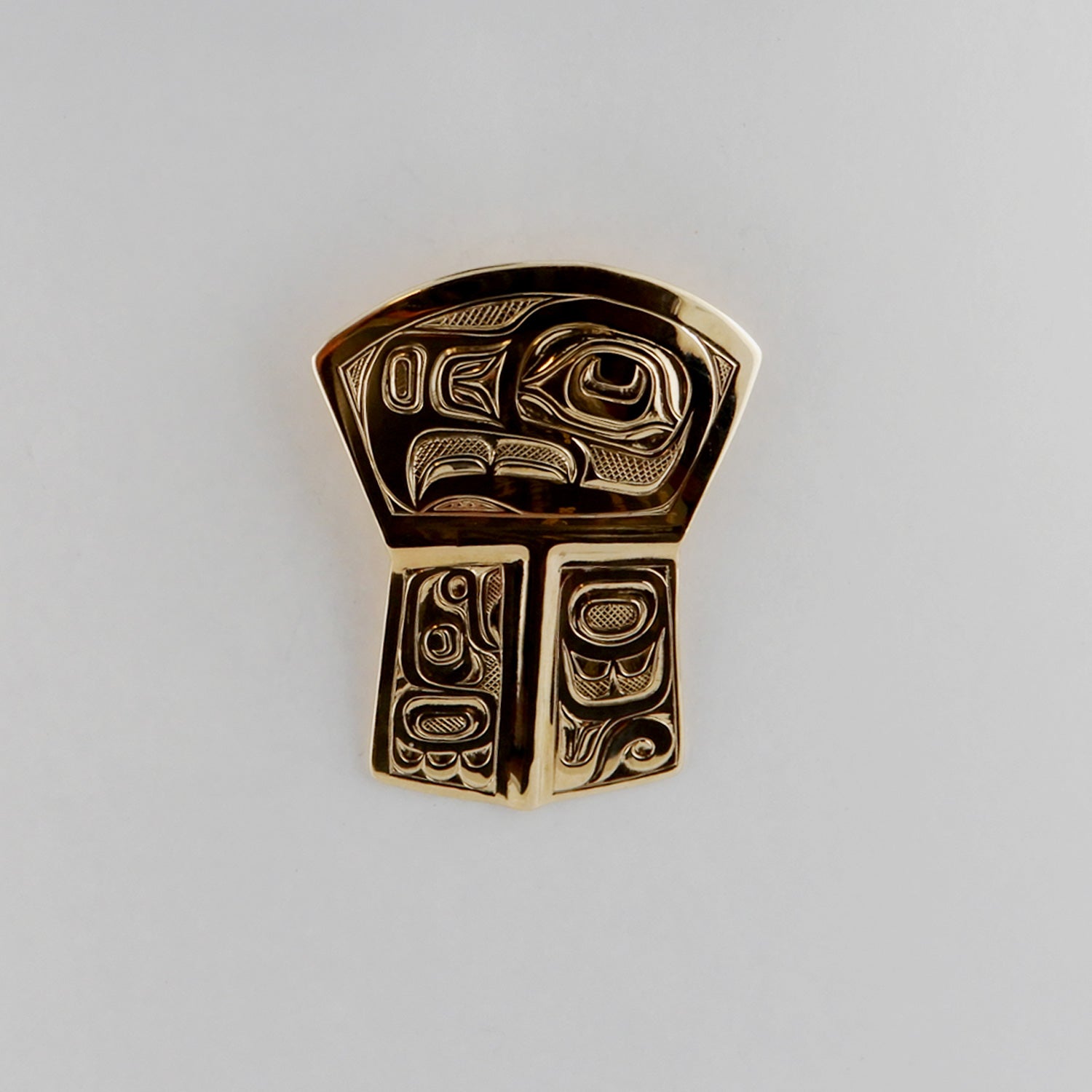 Gold Copper-shaped Eagle Pendant by Kwakwaka'wakw artist Joe Wilson