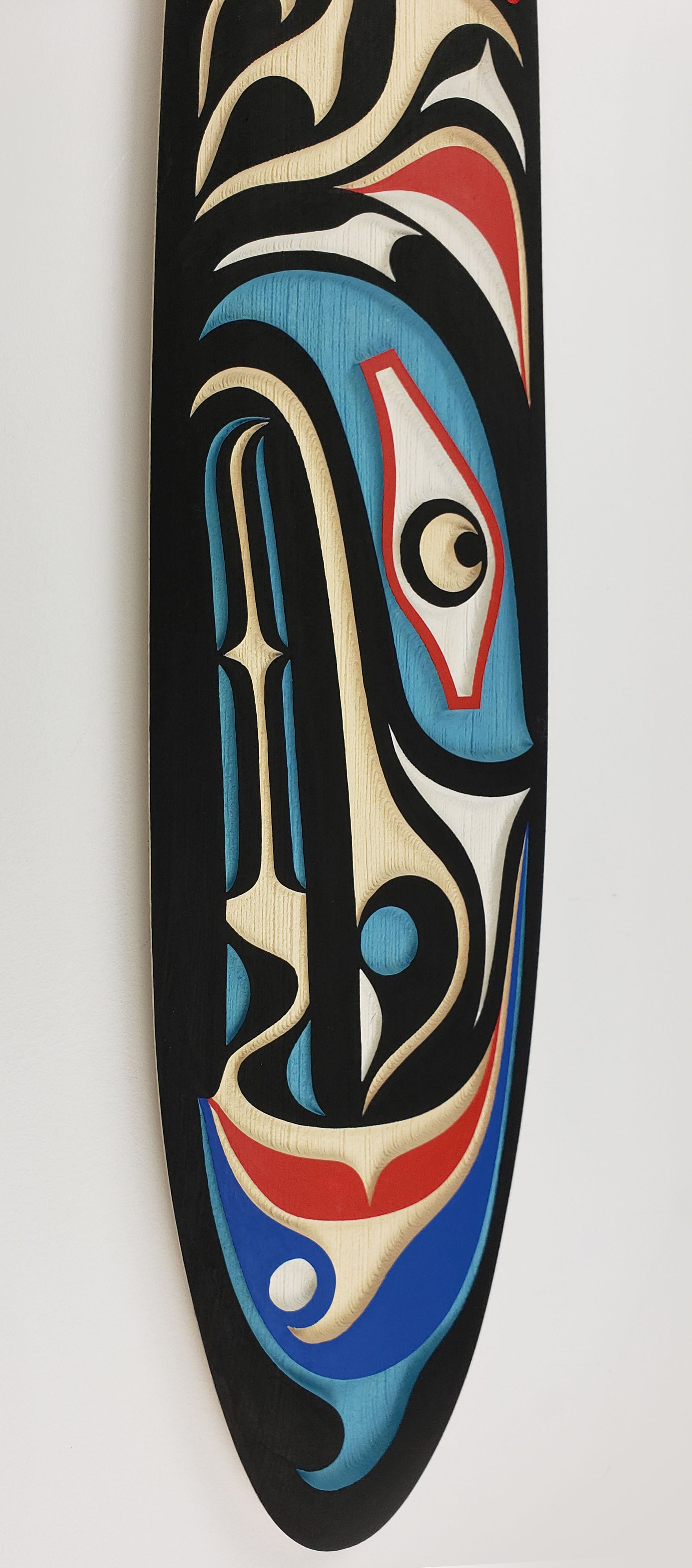 Sandblasted Cedar Sea Wolf Paddle by Kwakiutl artist Trevor Hunt