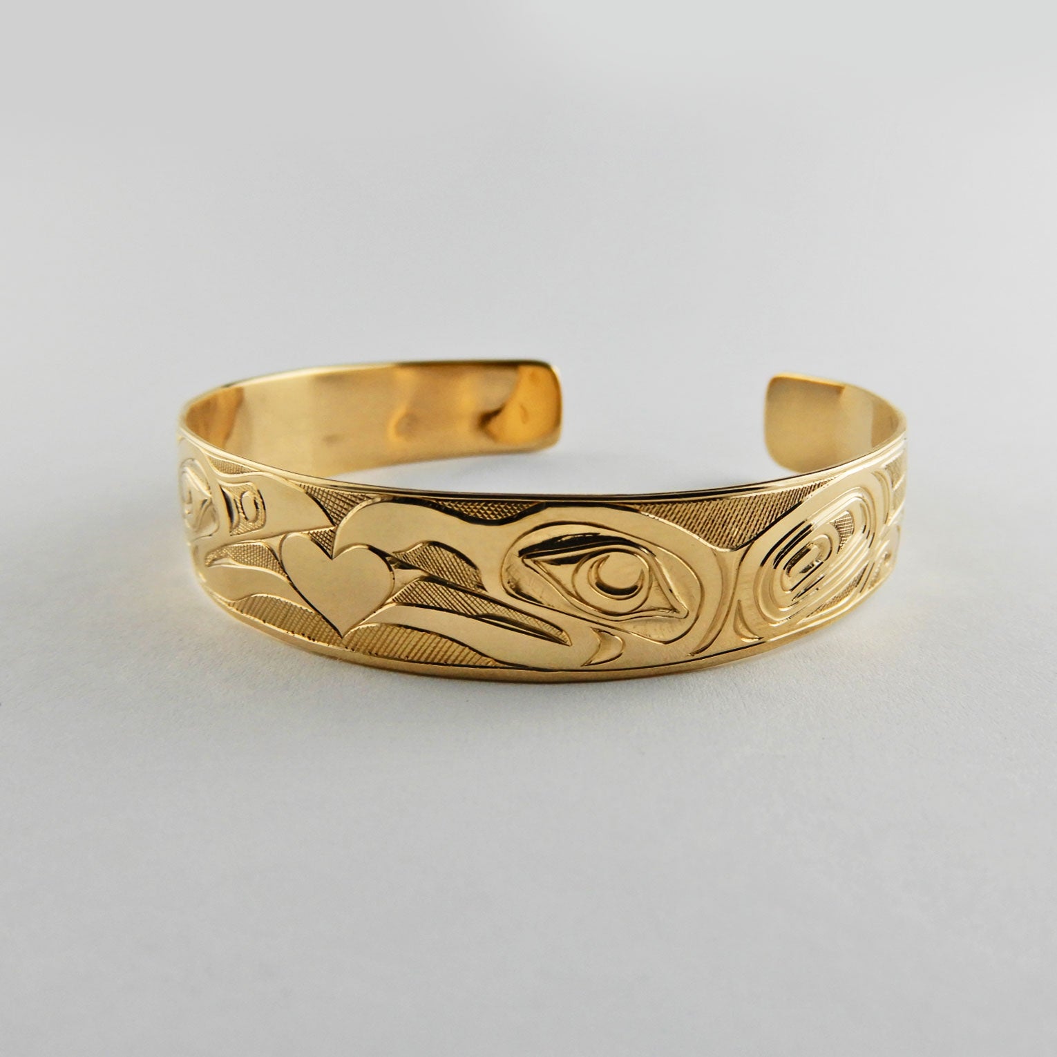 Gold First Nation Love Birds Bracelet by Kwakwaka'wakw artist Joe Wilson