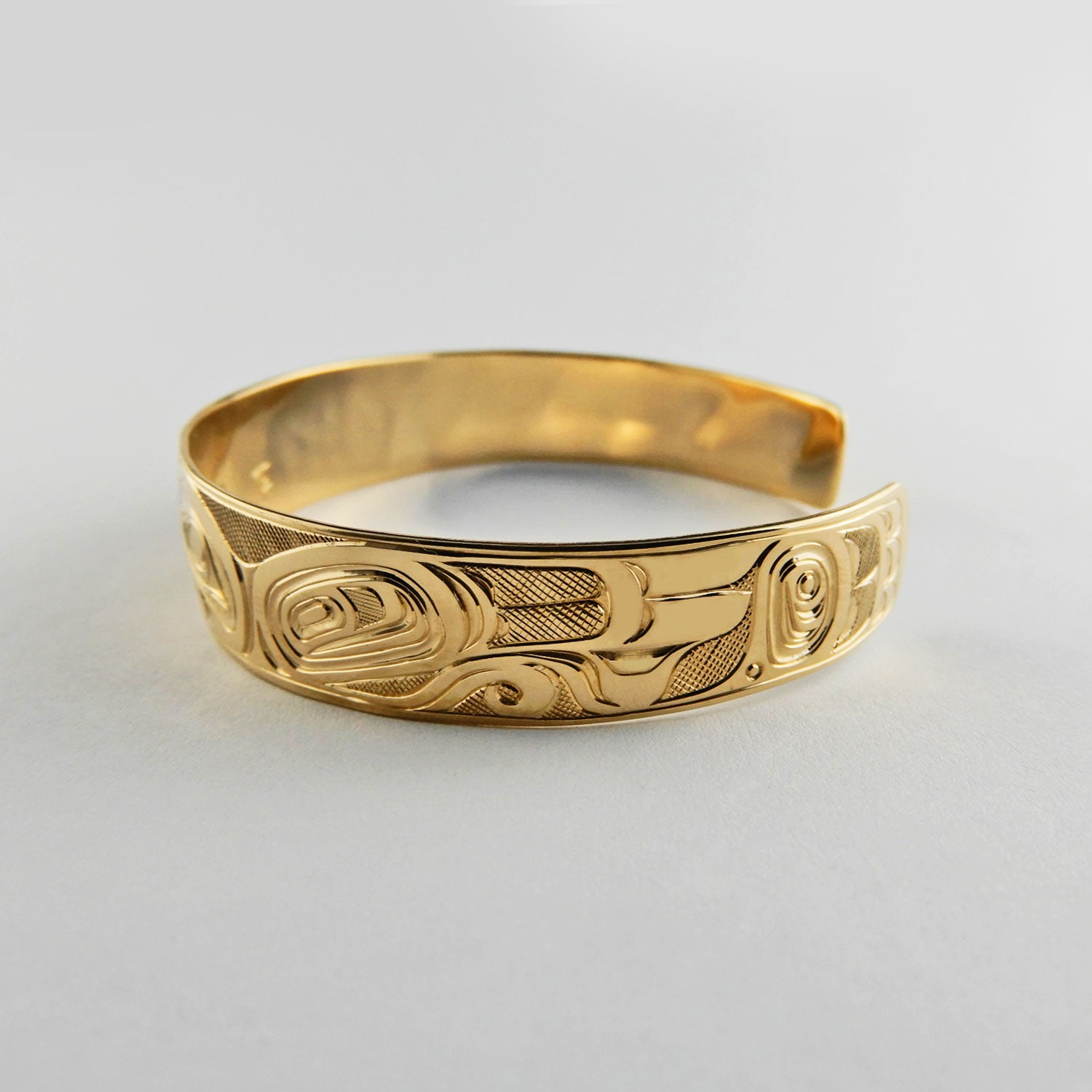 Gold First Nation Love Birds Bracelet by Kwakwaka'wakw artist Joe Wilson