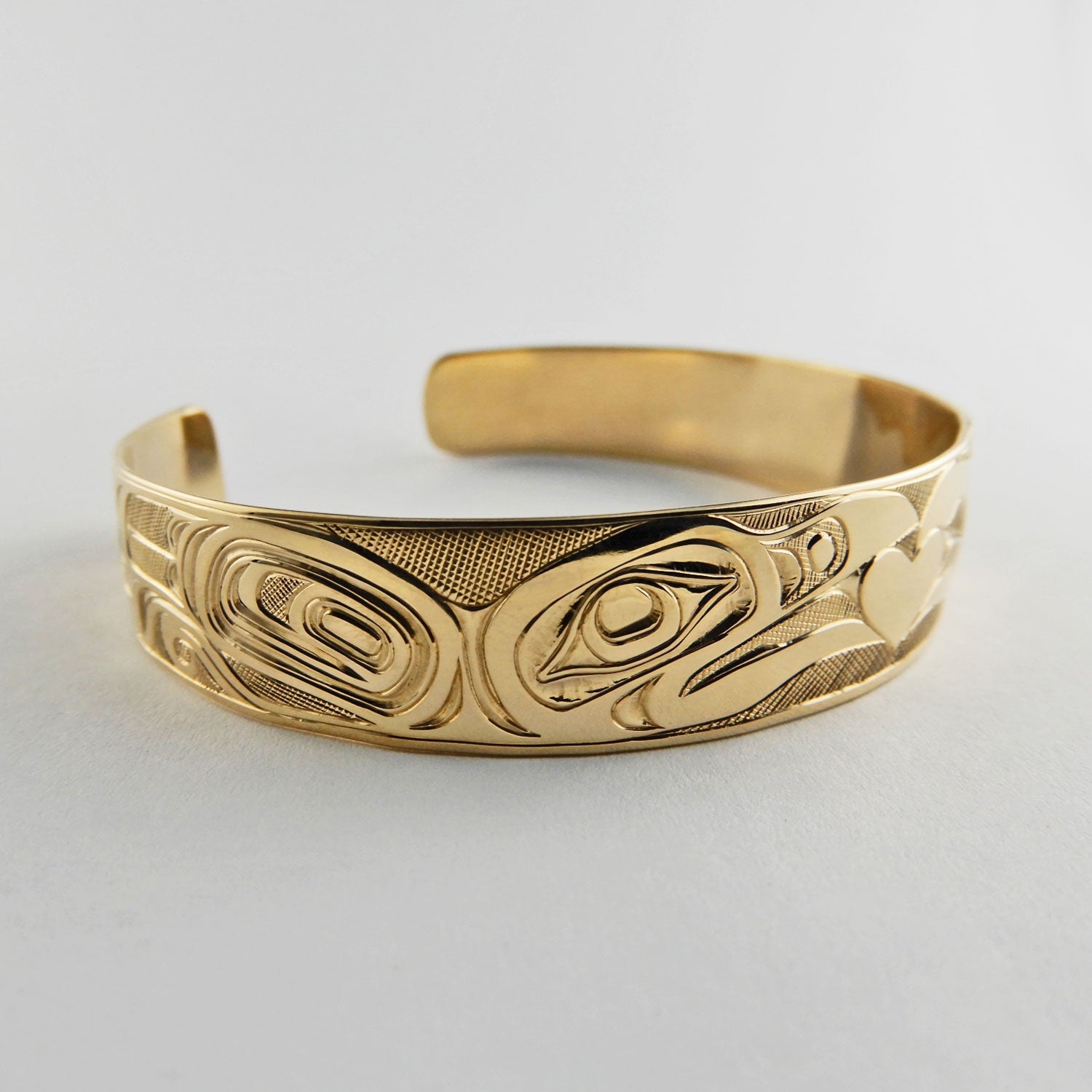Gold First Nation Love Birds Bracelet by Kwakwaka'wakw artist Joe Wilson