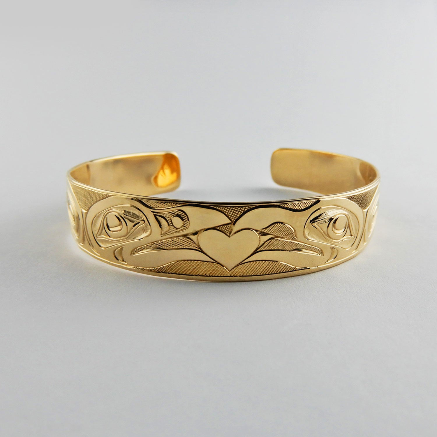 Gold First Nation Love Birds Bracelet by Kwakwaka'wakw artist Joe Wilson