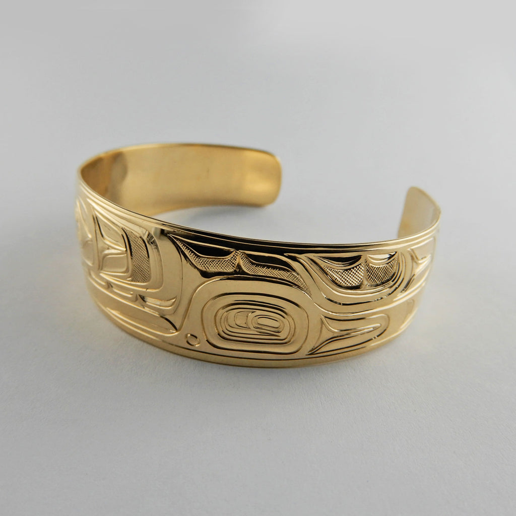 Gold First Nations Orca Bracelet by Kwakwaka'wakw artist Joe Wilson