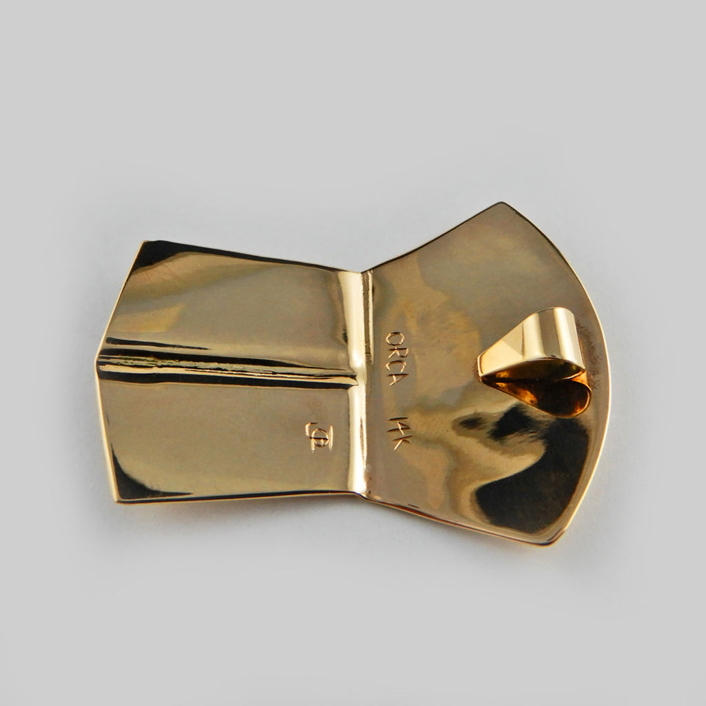 Gold Copper-shaped Orca Pendant by Kwakwaka'wakw artist Joe Wilson