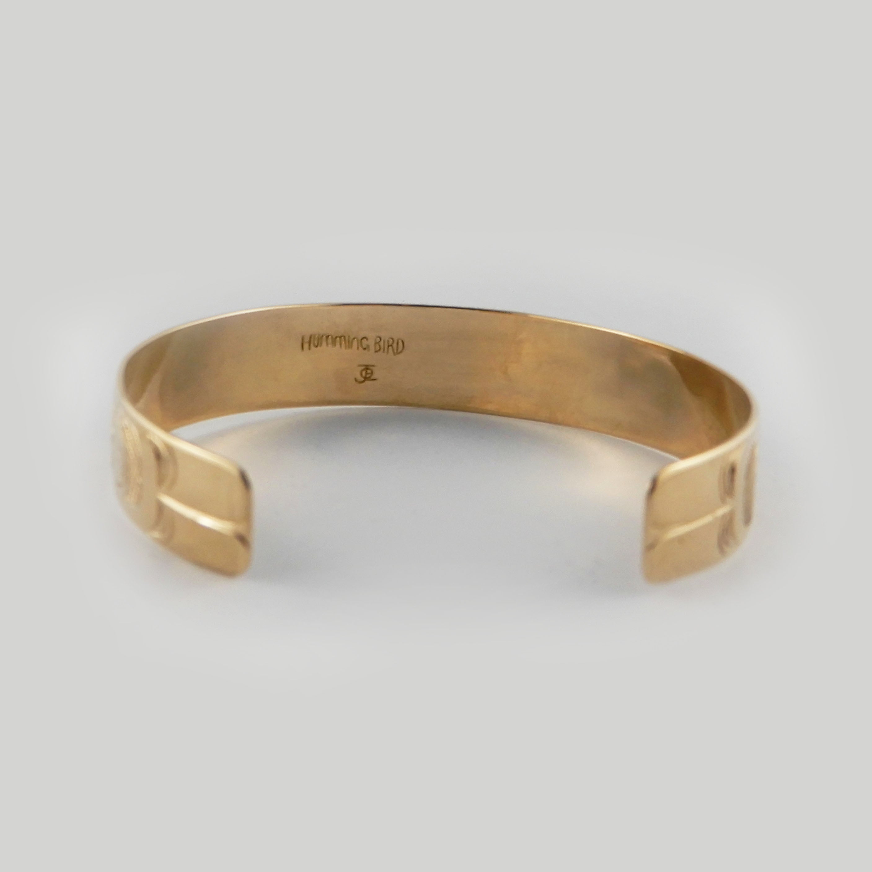 Gold Hummingbird First Nations Bracelet by Kwakwaka'wakw artist Joe Wilson