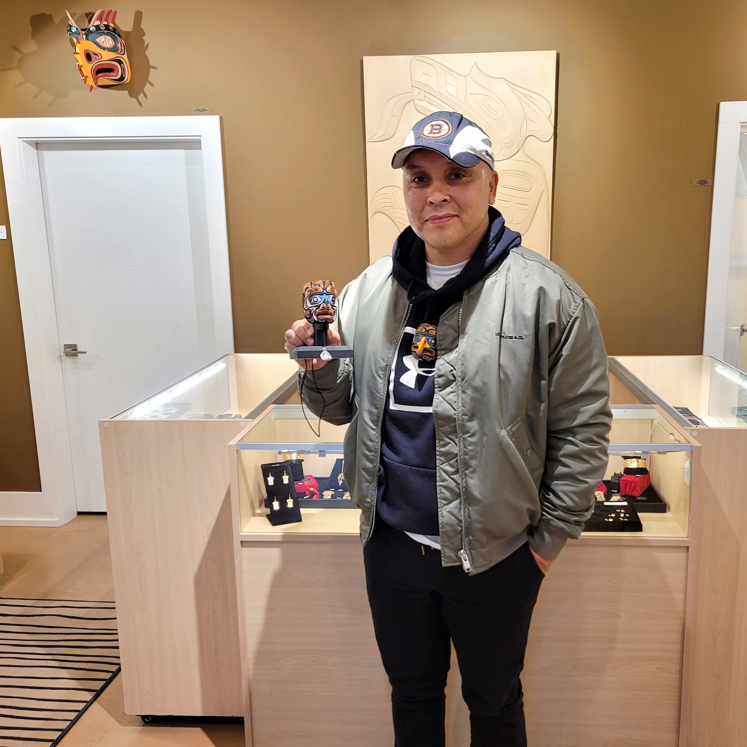 Kwakwaka'wakw carver Kevin Cranmer wearing Wood King of the Undersea Mask Pendant