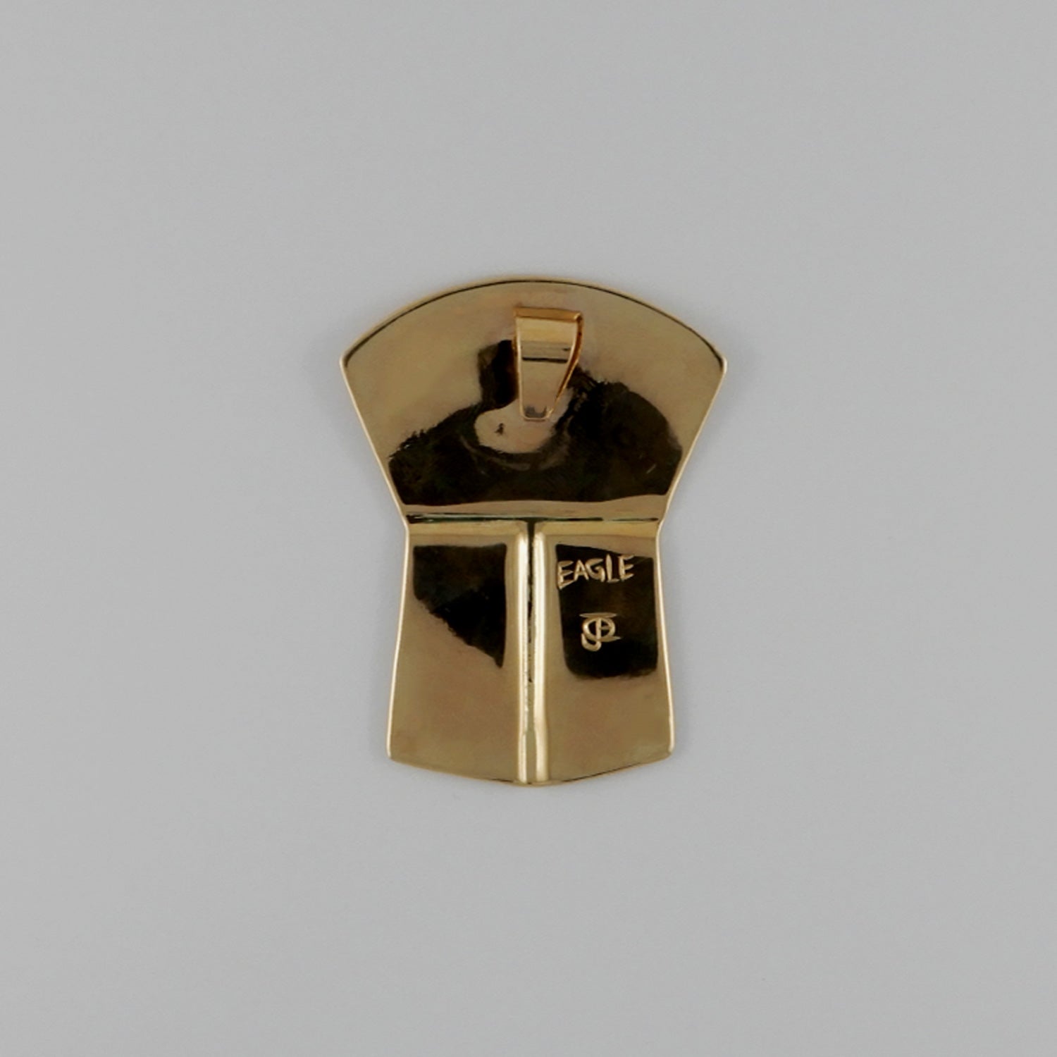 Gold Copper-shaped Eagle Pendant by Kwakwaka'wakw artist Joe Wilson