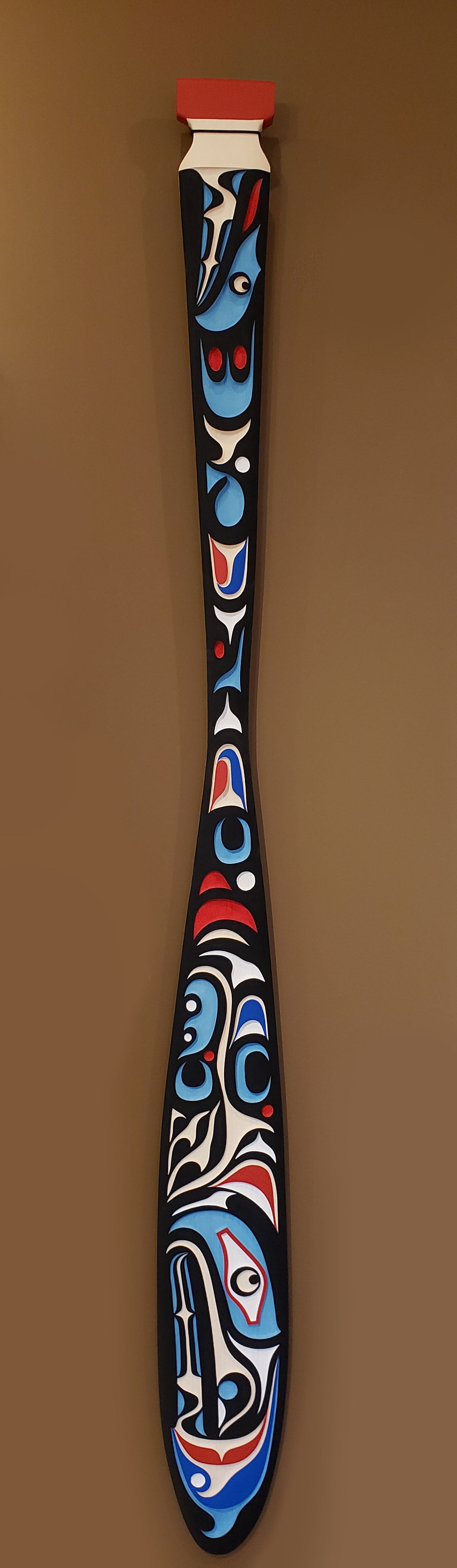Sandblasted Cedar Sea Wolf Paddle by Kwakiutl artist Trevor Hunt