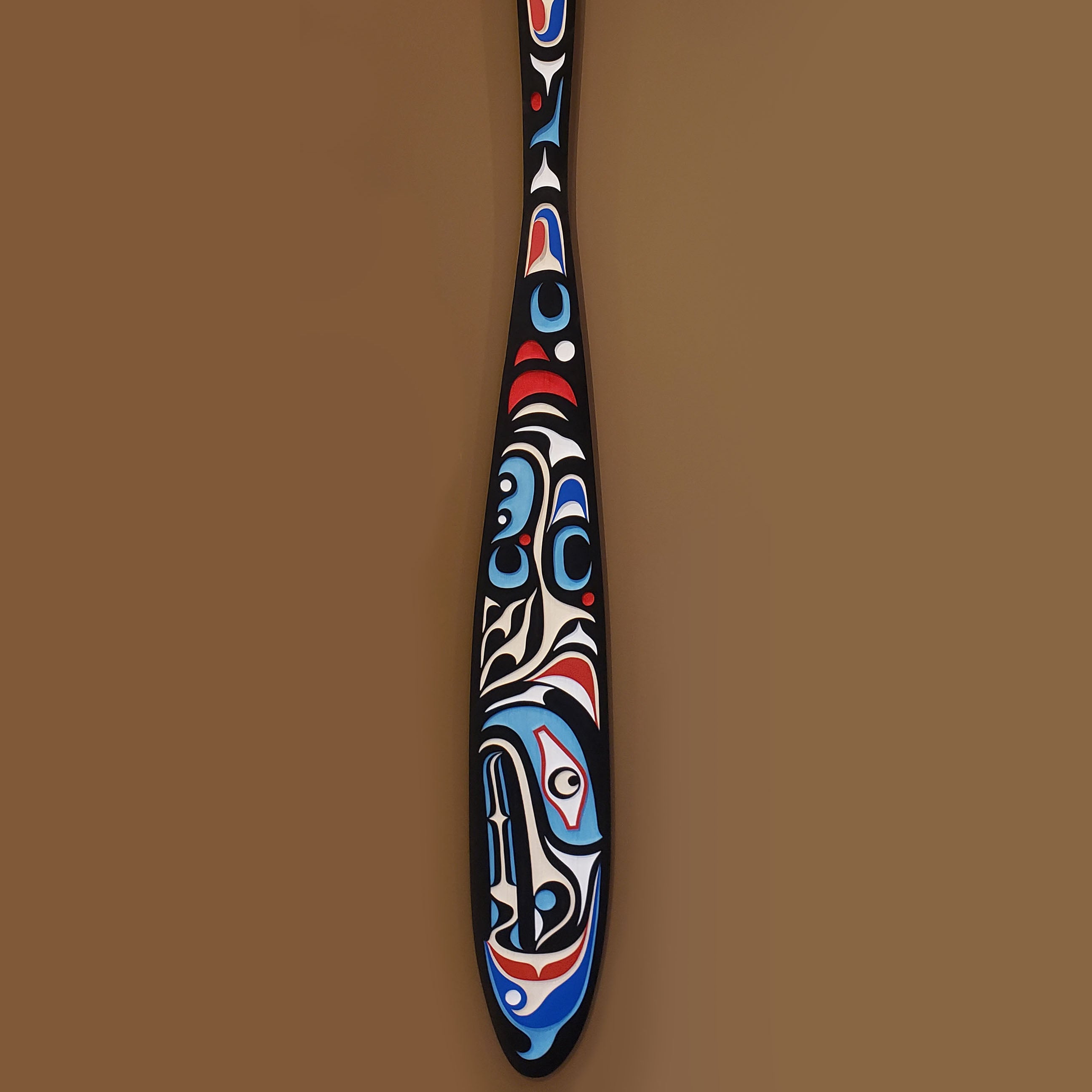 Sandblasted Cedar Sea Wolf Paddle by Kwakiutl artist Trevor Hunt