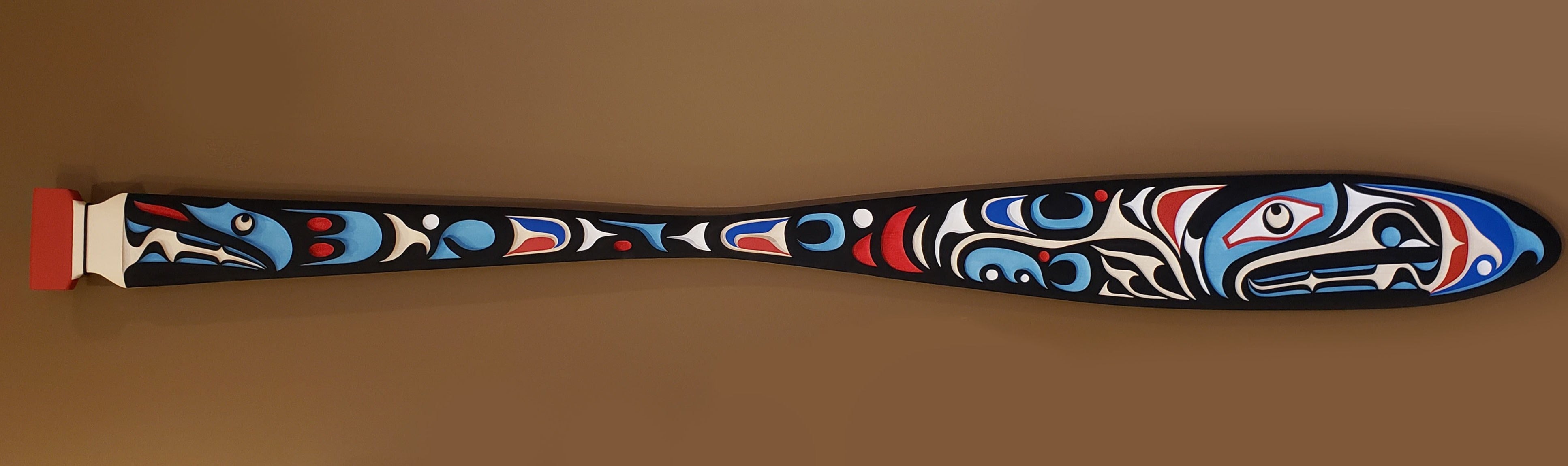 Sandblasted Cedar Sea Wolf Paddle by Kwakiutl artist Trevor Hunt
