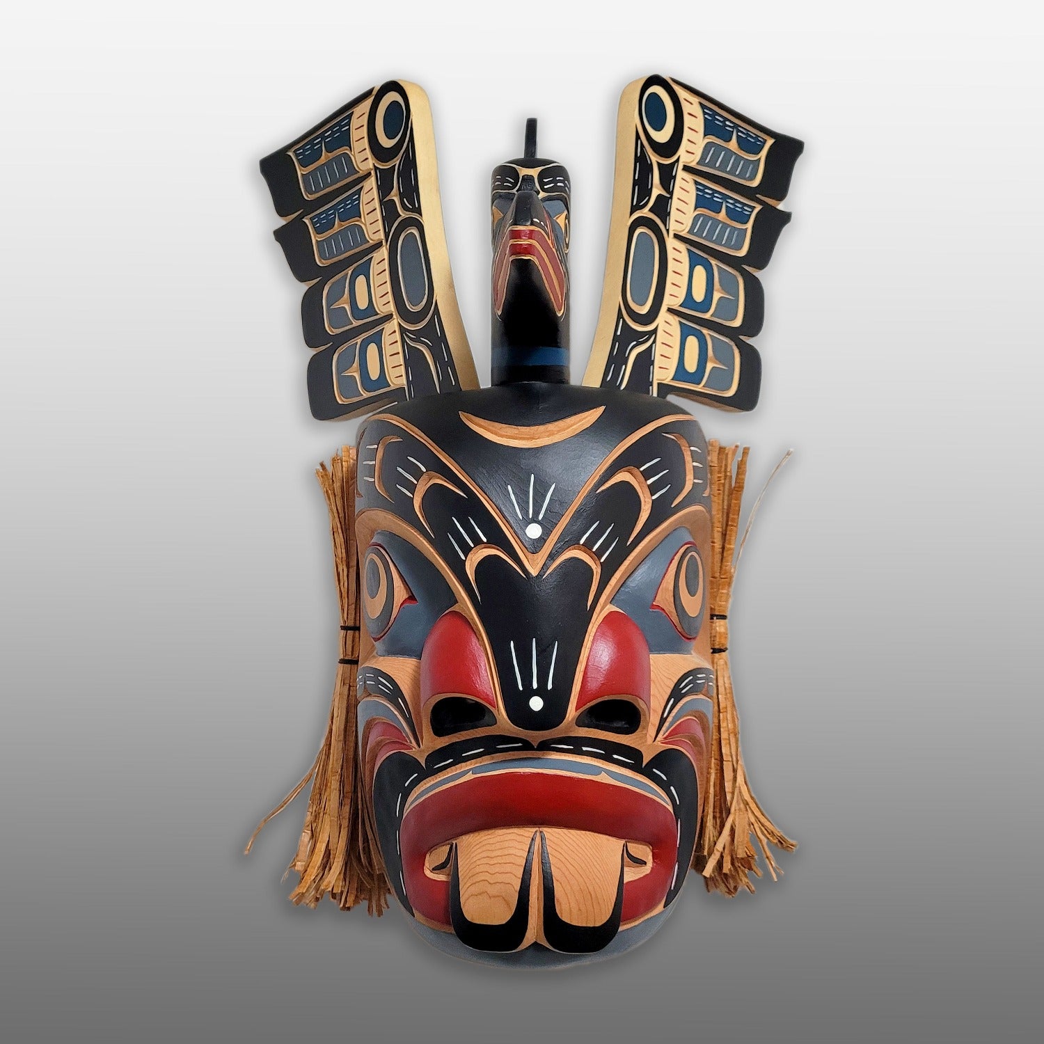 Pugwis and Raven Indigenous Mask hand-carved by Kwakwaka'wakw artist Bill Henderson
