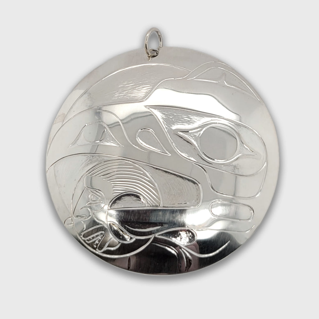 Silver Raven Steals the Light Pendant by Haida Master Carver Ron Russ