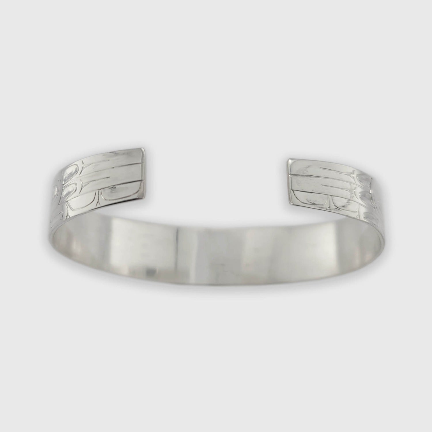 Silver and Gold Ravens Bracelet by Haida artist Andrew Williams