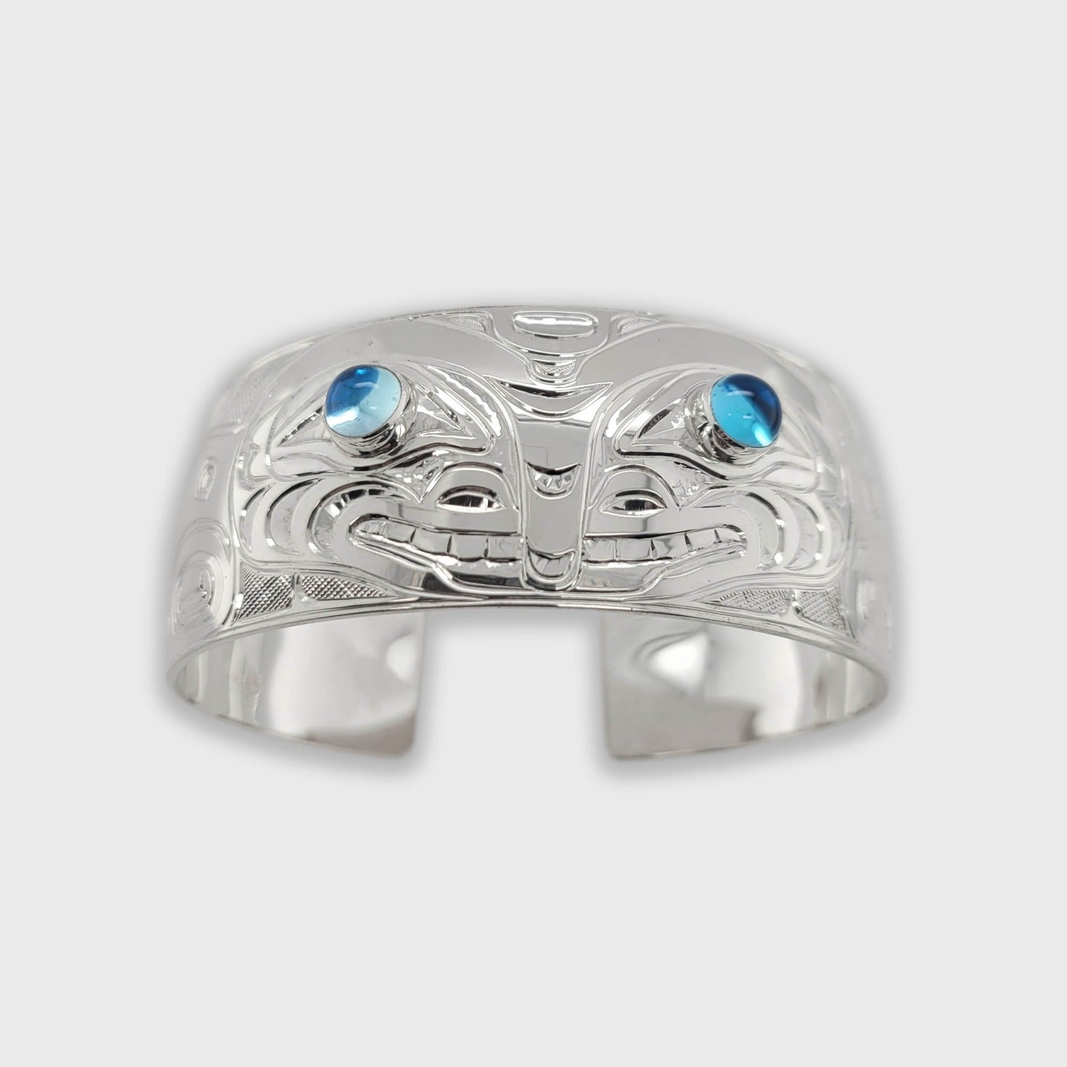 Silver and Topaz Orca Bracelet by Kwakwaka'wakw artist Chris Cook