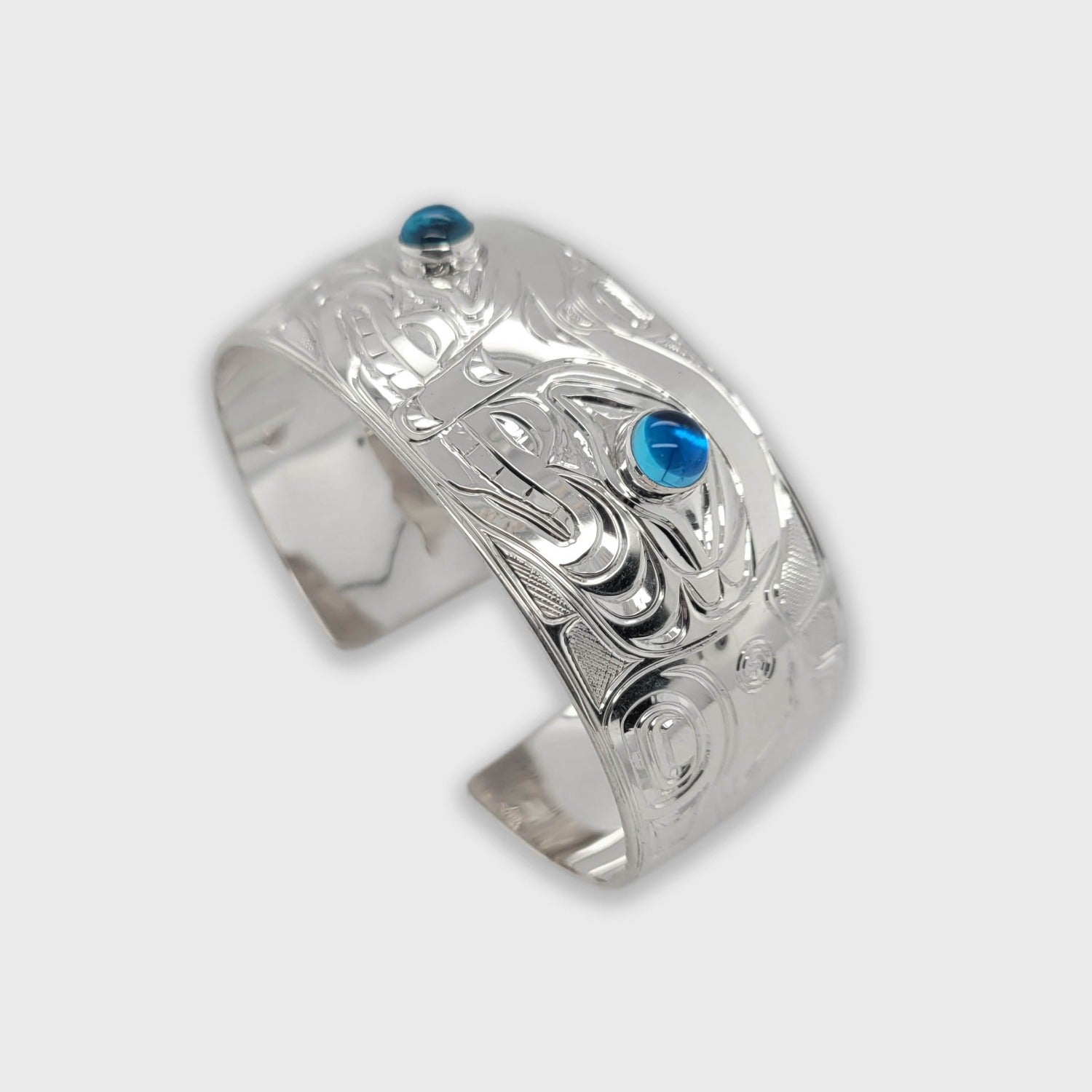 Silver and Topaz Orca Bracelet by Kwakwaka'wakw artist Chris Cook