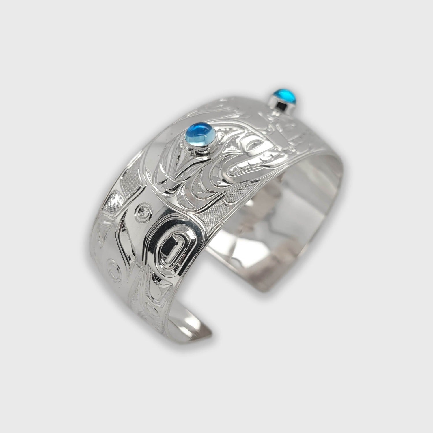 Silver and Topaz Orca Bracelet by Kwakwaka'wakw artist Chris Cook