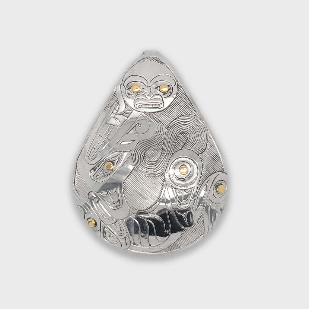 Indigenous silver and gold He Who Loves the Moon pendant by Haida artist Andrew Williams